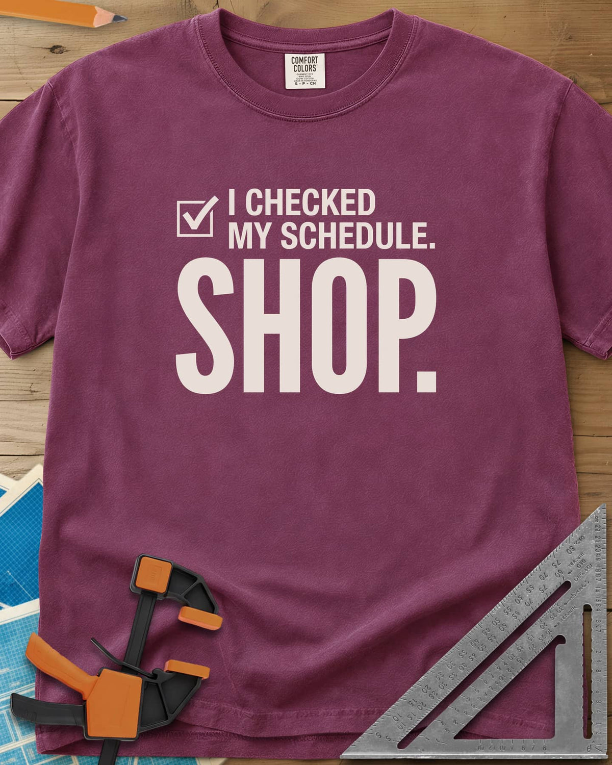 I Checked My Schedule Shop heavyweight tee in Berry, a checked box beside small text and a huge SHOP below