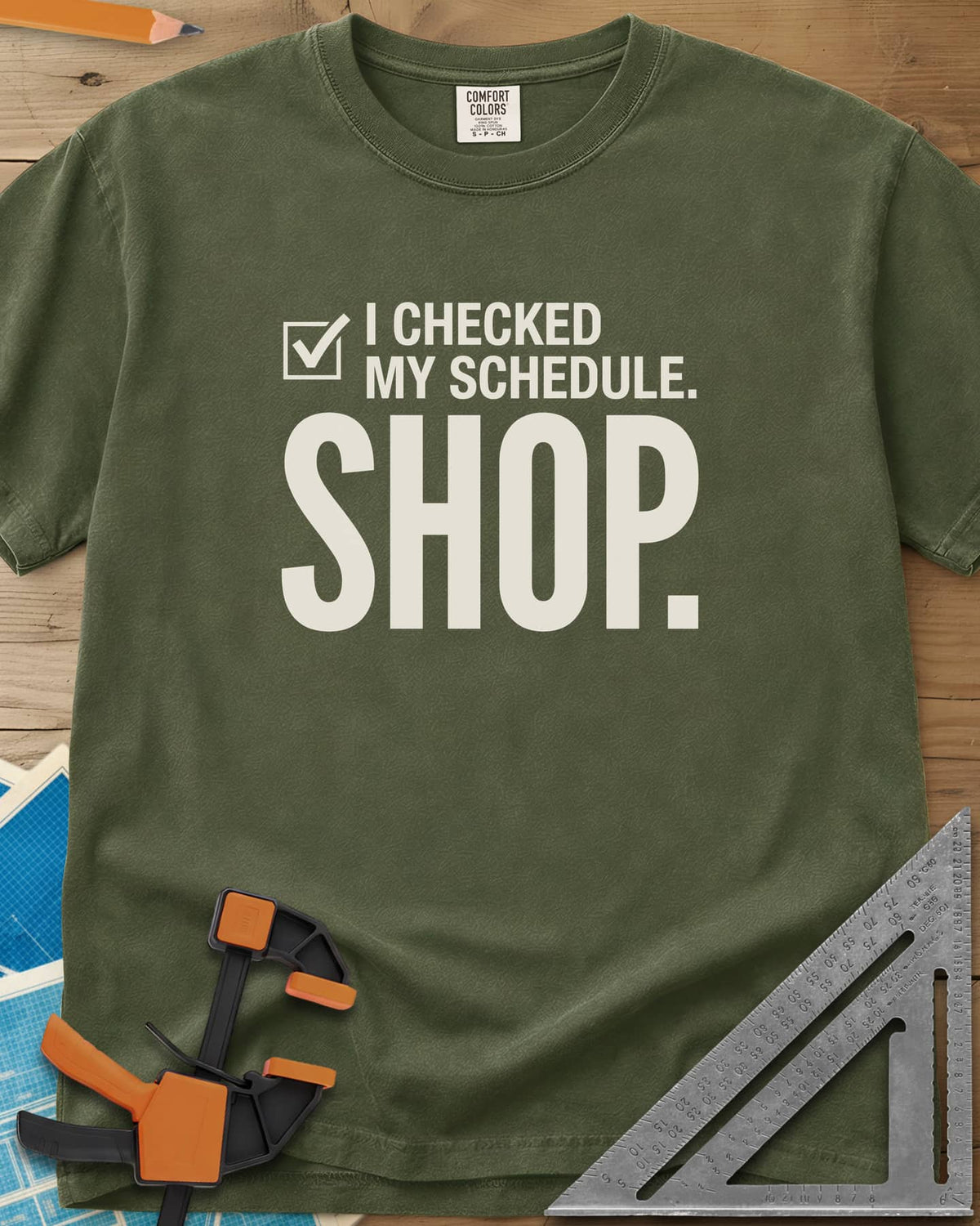 I Checked My Schedule Shop heavyweight tee in Hemp, a checked box beside small text and a huge SHOP below