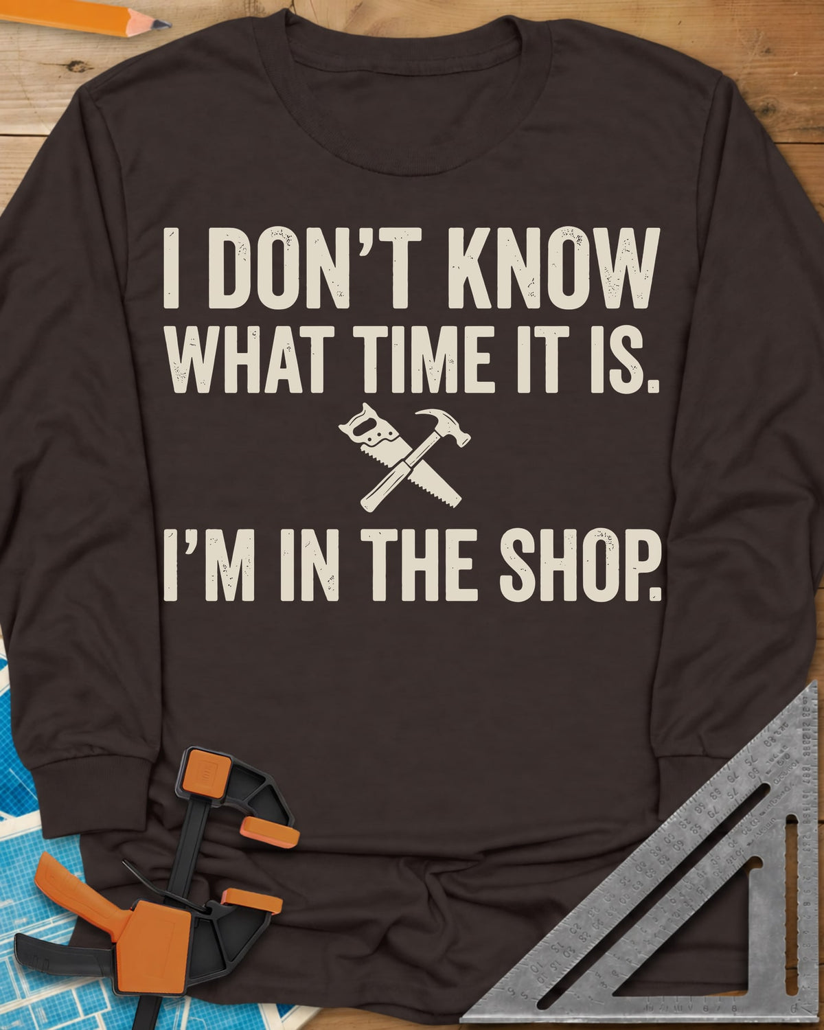 I Don't Know What Time It Is long sleeve shirt in Dark Chocolate, a small crossed handsaw and hammer between two lines of