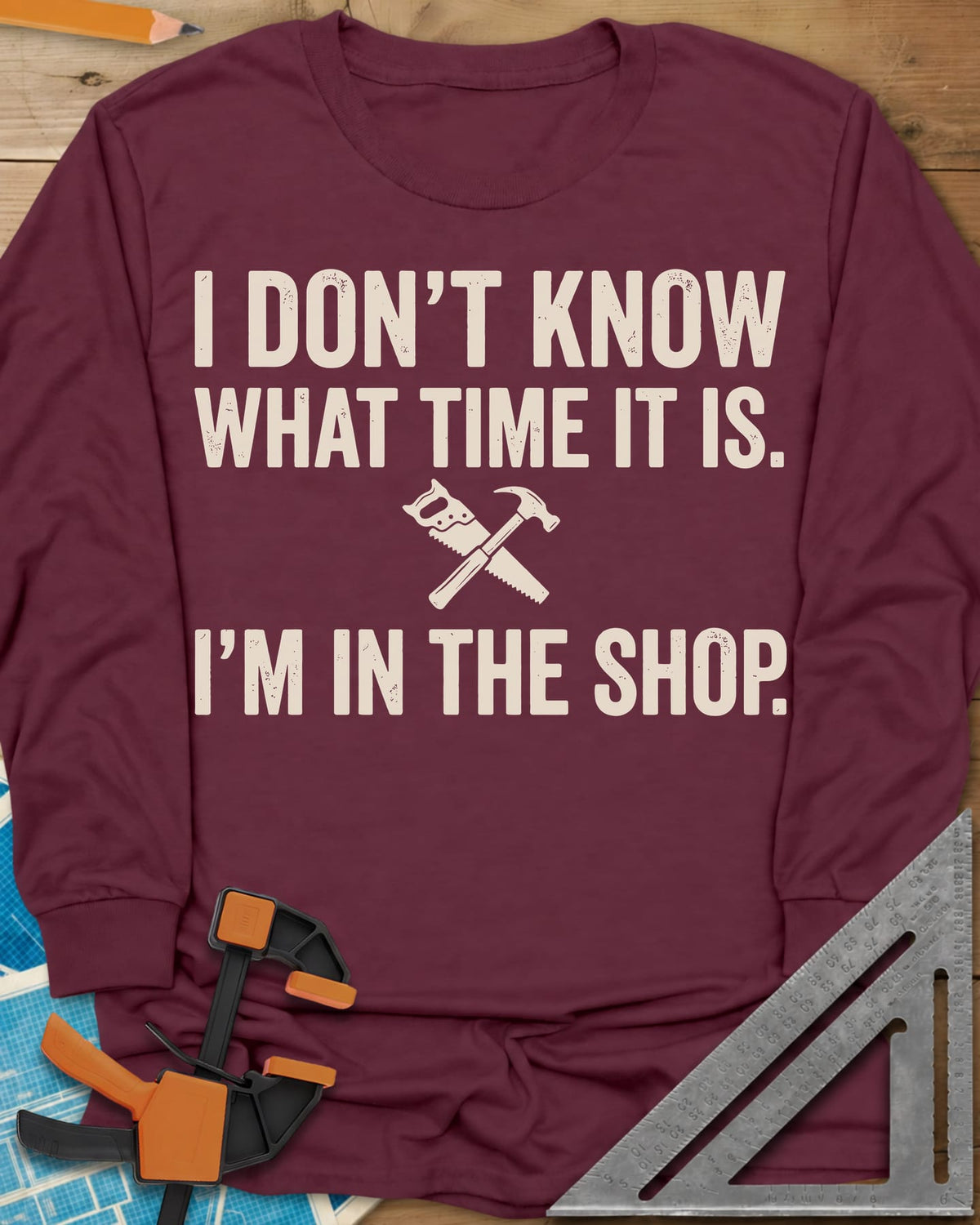 I Don't Know What Time It Is long sleeve shirt in Maroon, a small crossed handsaw and hammer between two lines of text
