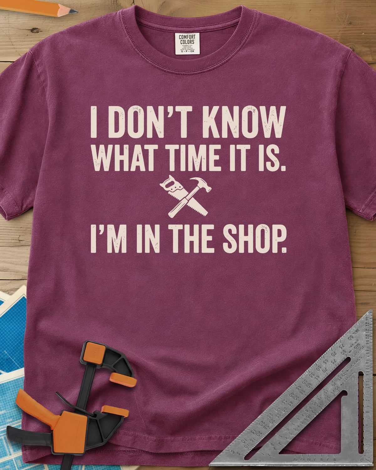 I Don't Know What Time It Is heavyweight tee in Berry, a small crossed handsaw and hammer between two lines of text