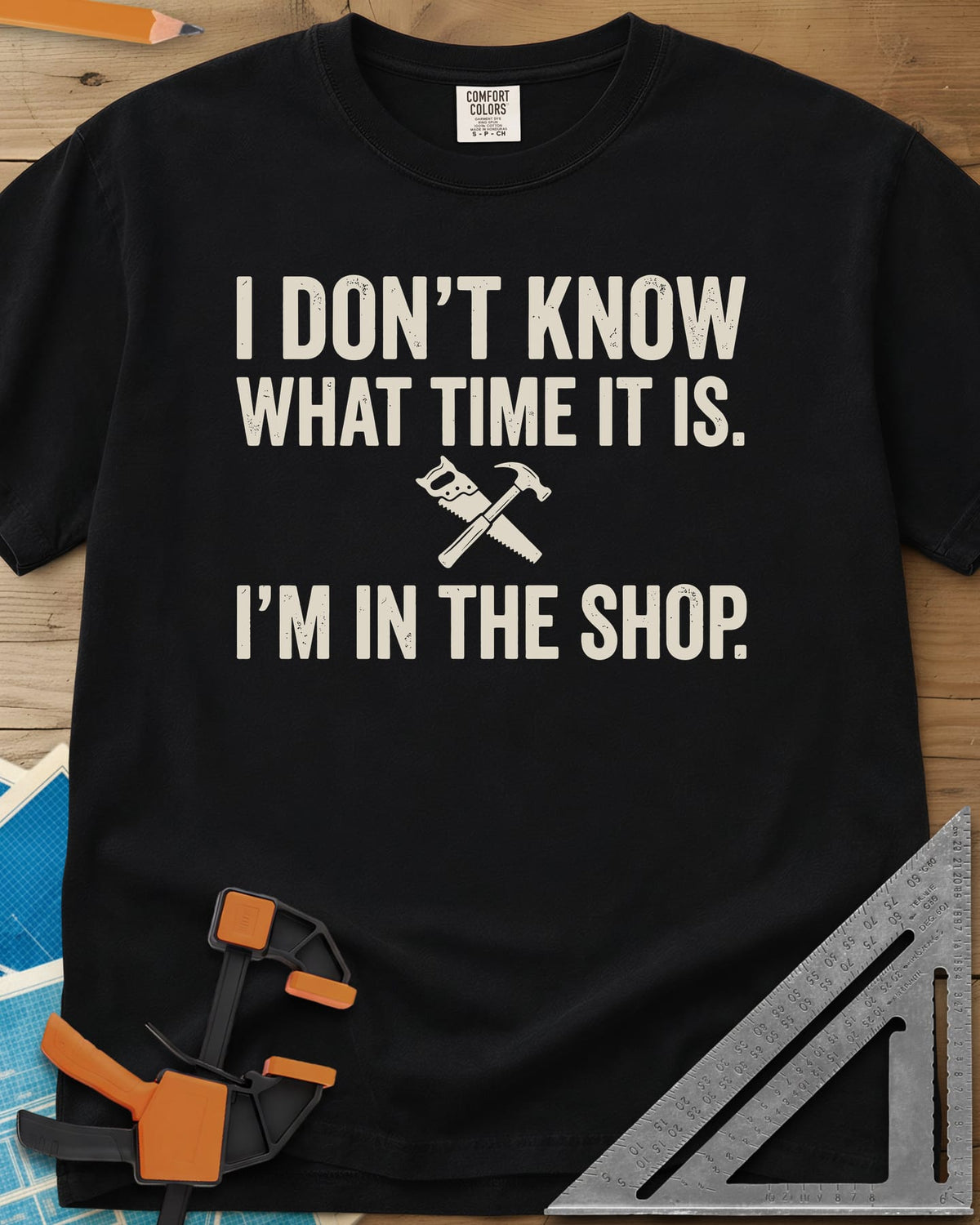 I Don't Know What Time It Is heavyweight tee in Black, a small crossed handsaw and hammer between two lines of text