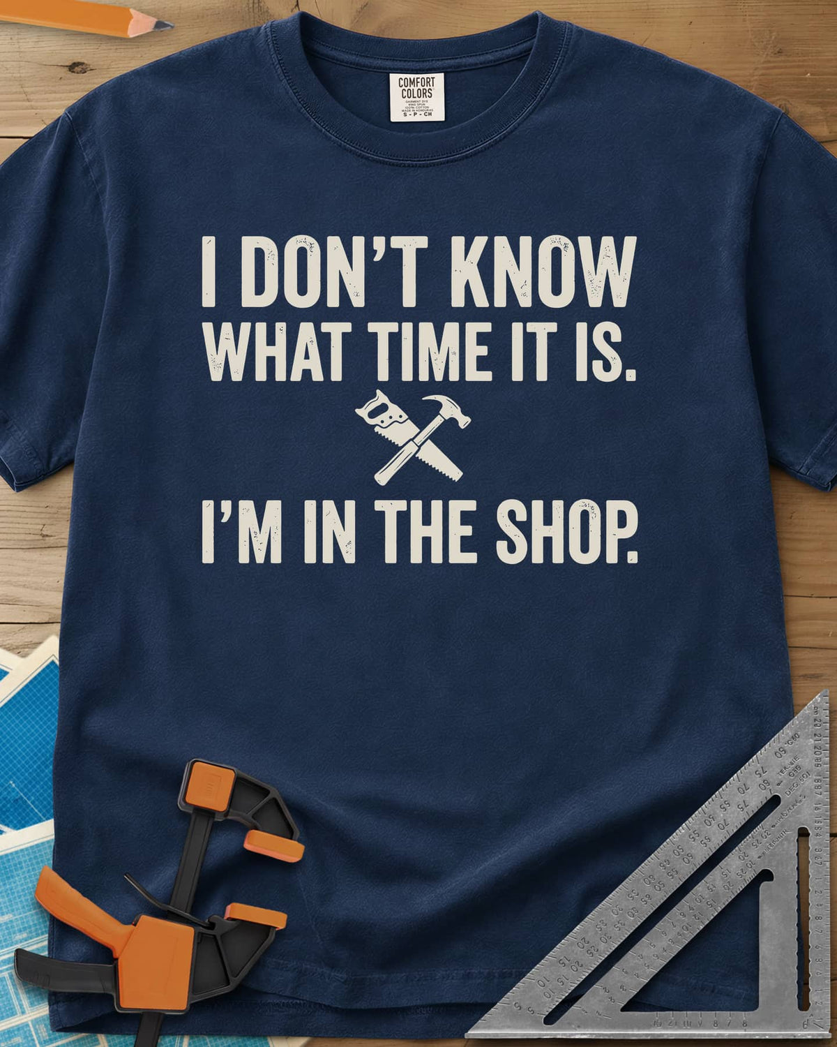 I Don't Know What Time It Is heavyweight tee in Navy, a small crossed handsaw and hammer between two lines of text