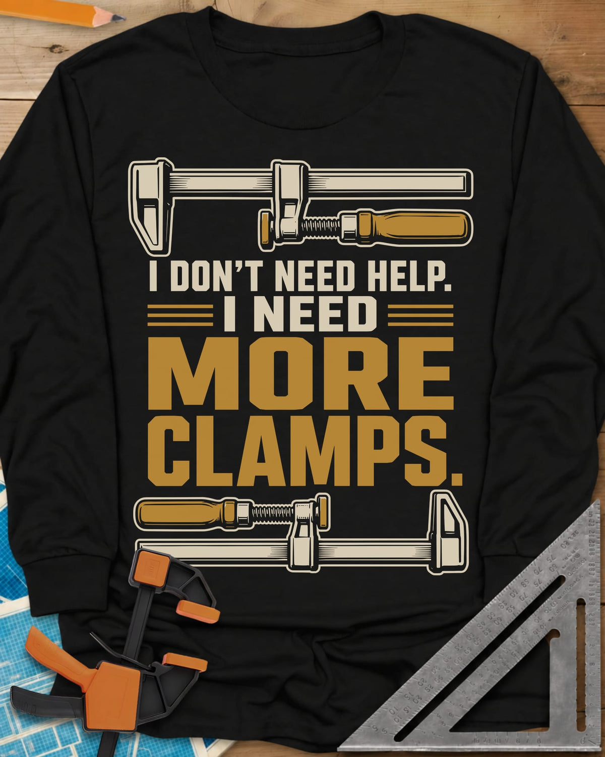 I Don't Need Help I Need More Clamps long sleeve shirt in Black, two bar clamps above and below bold stacked lettering