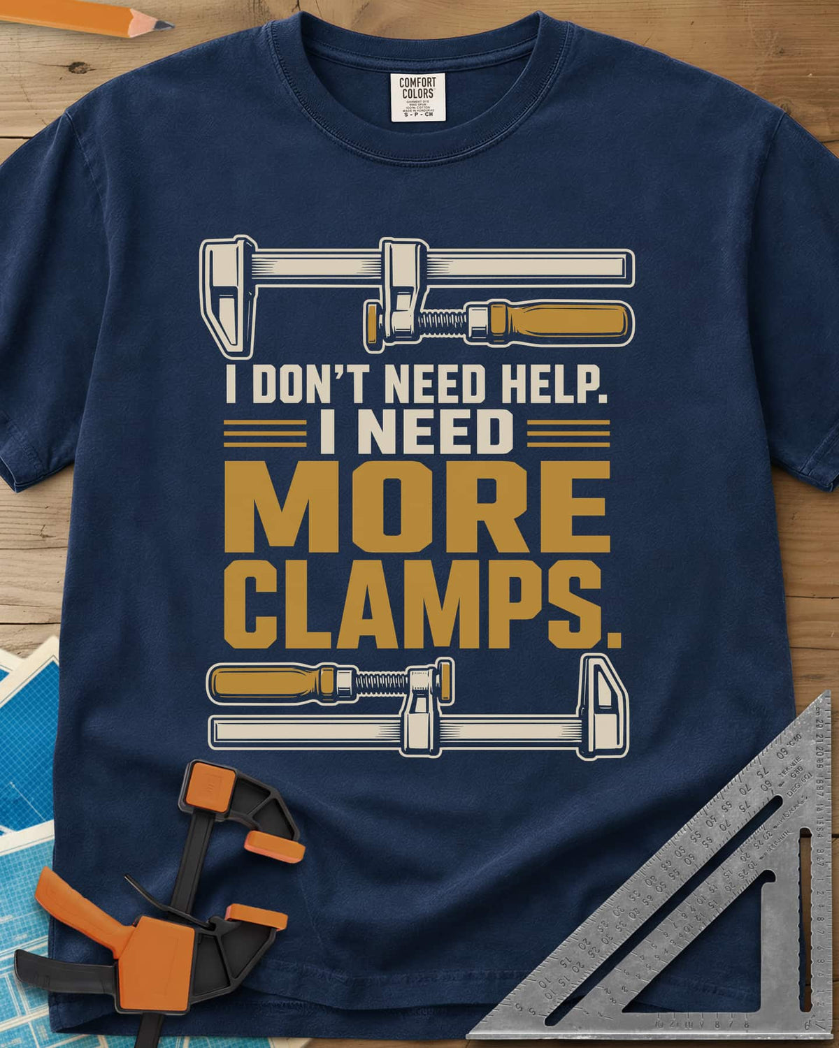 I Don't Need Help I Need More Clamps heavyweight tee in Navy, two bar clamps above and below bold stacked lettering