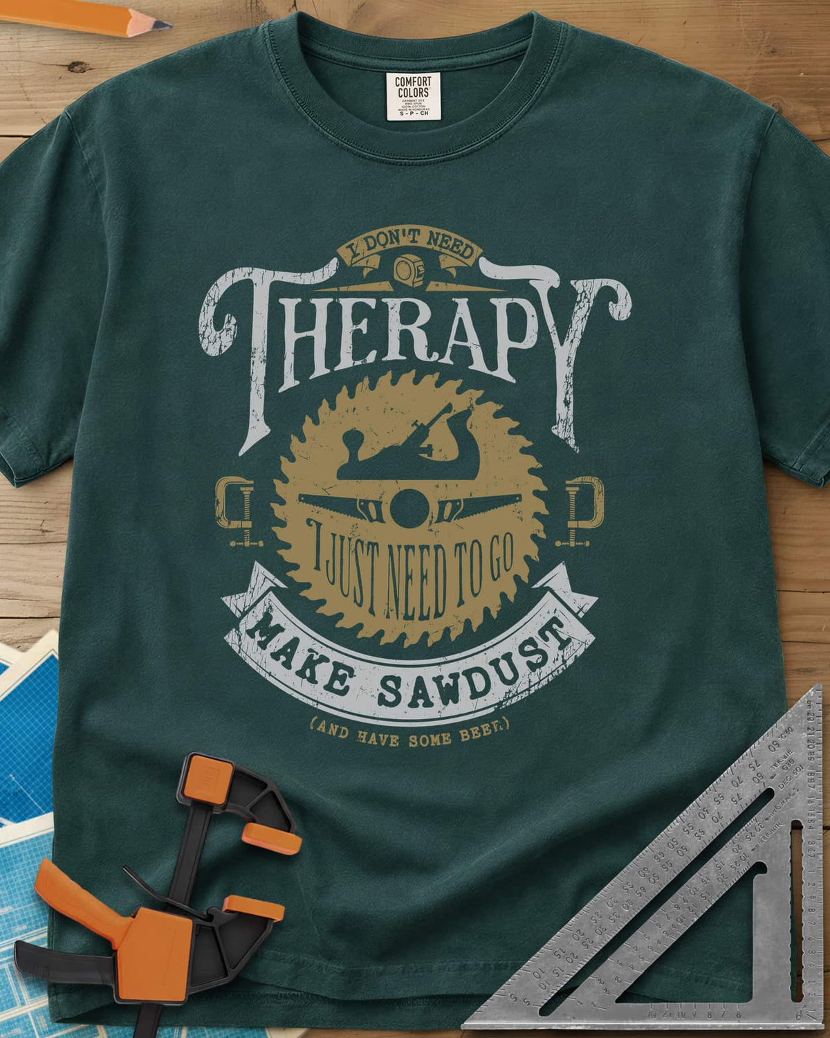 I Don't Need Therapy heavyweight tee in Blue Spruce, vintage badge with a saw blade, hand plane, clamps and a banner