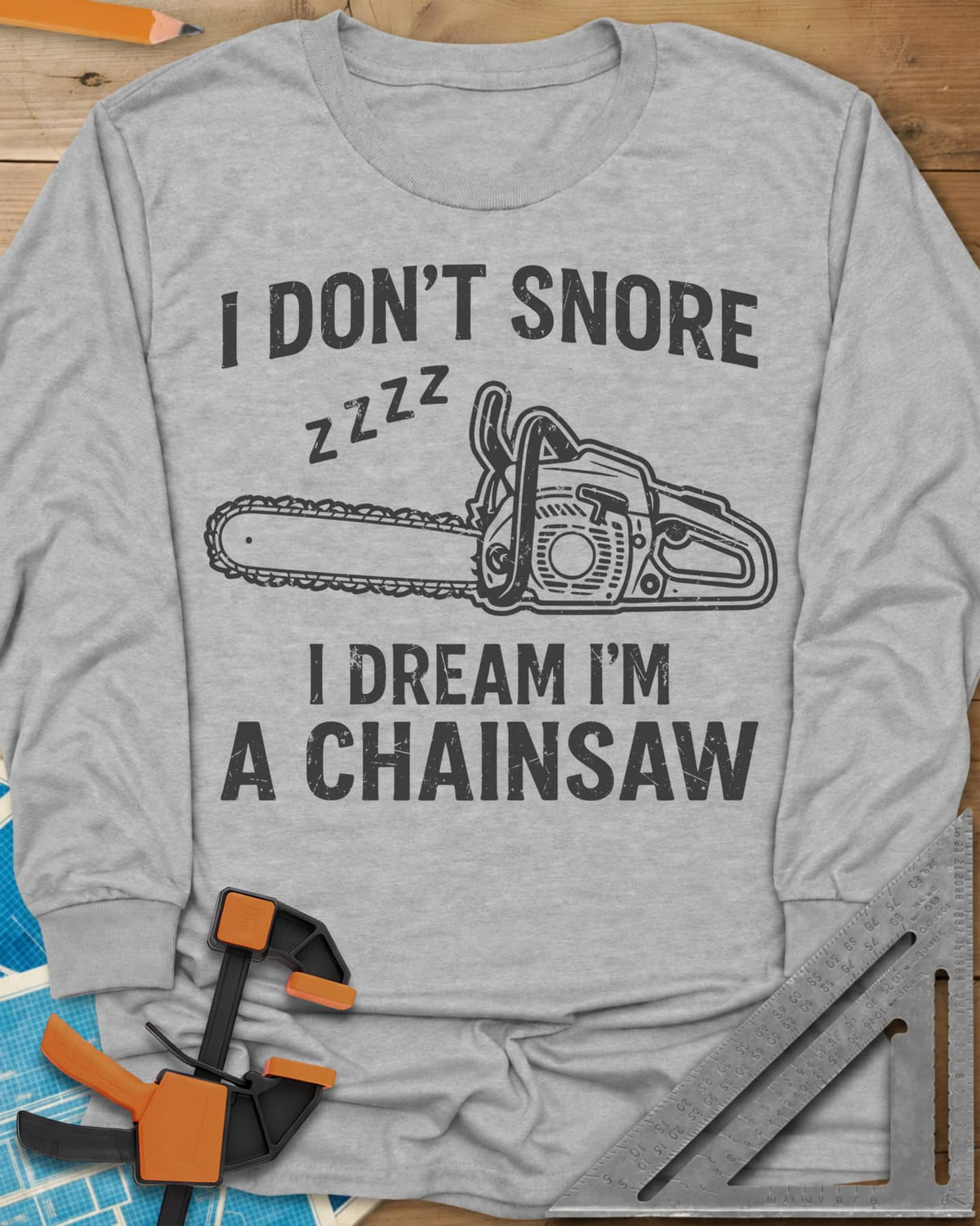 I Dream I'm A Chainsaw long sleeve shirt in Sport Grey, a chainsaw with zzzz above it between two lines of text