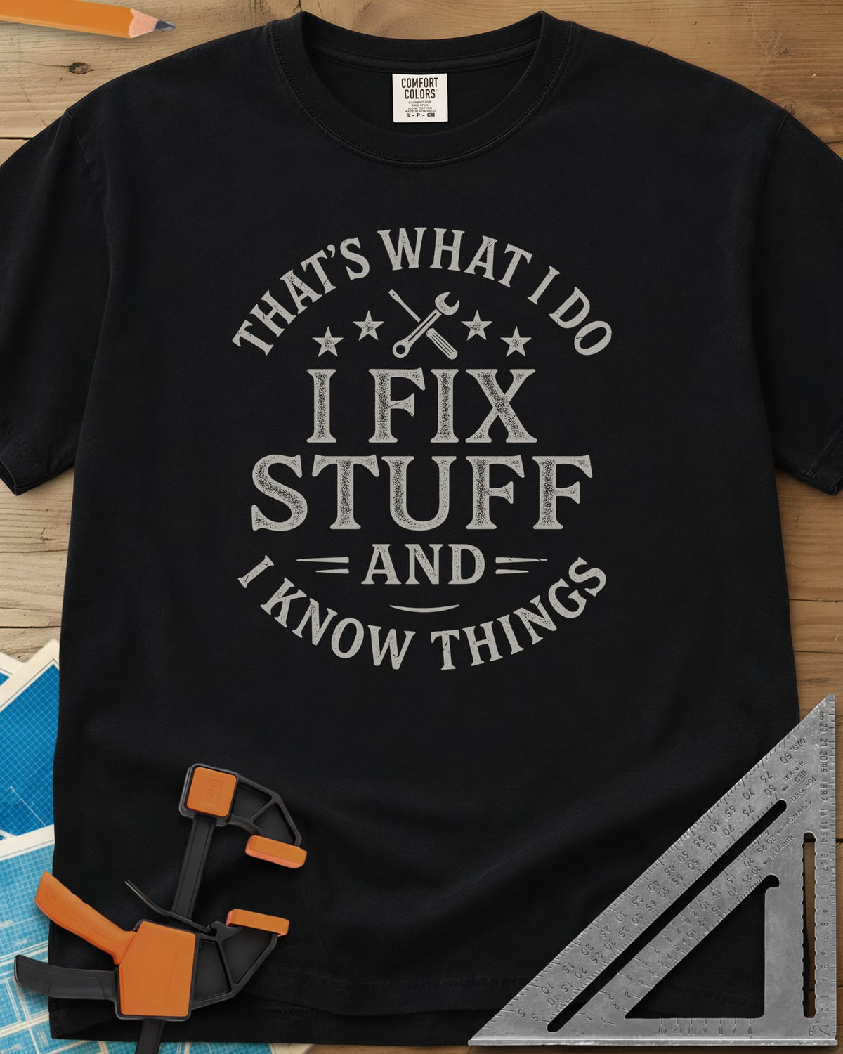 I Fix Stuff heavyweight tee in Black, round badge lettering with crossed screwdriver and wrench, four stars