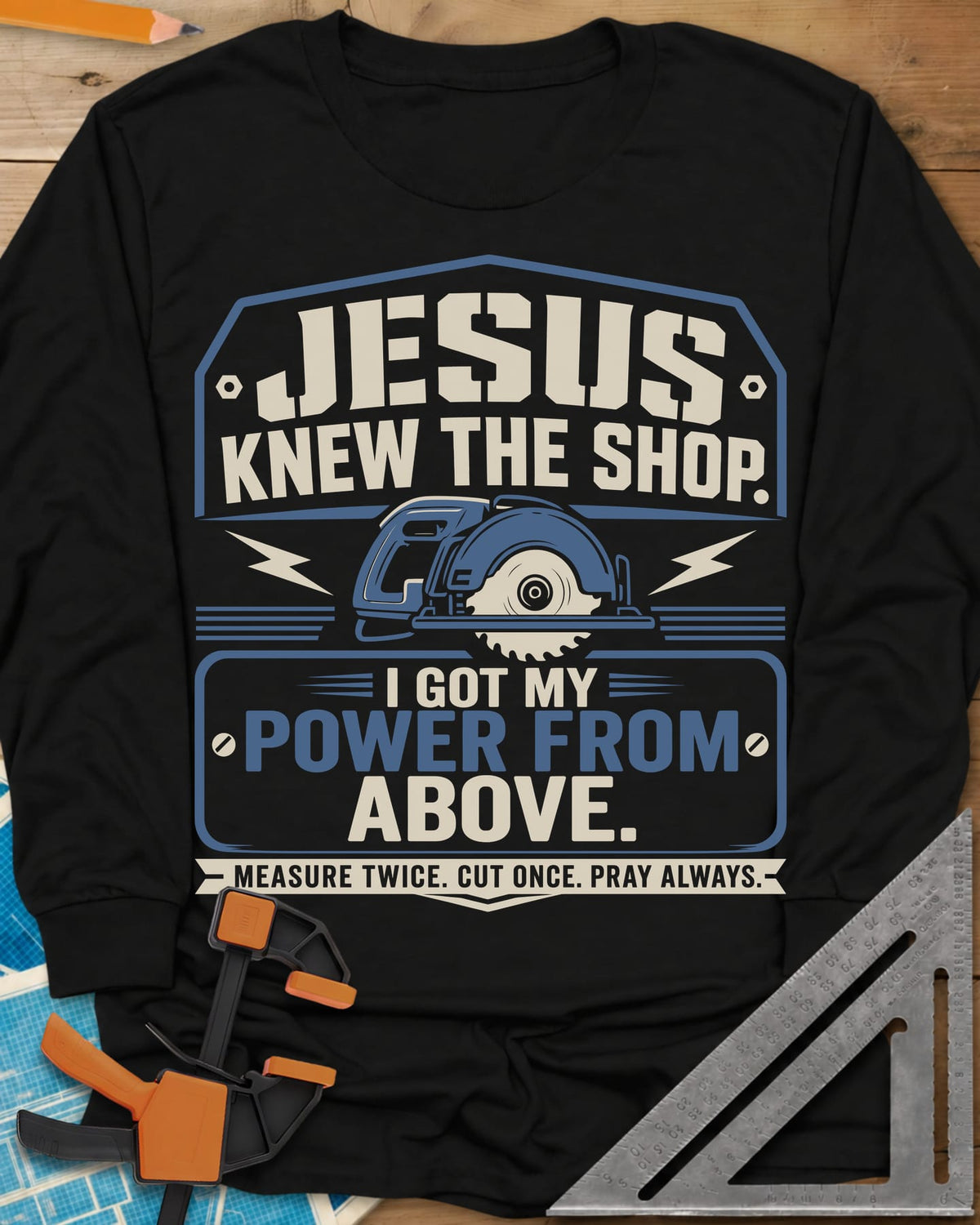 I Got My Power From Above long sleeve shirt in Black, a blue circular saw with lightning bolts in a badge