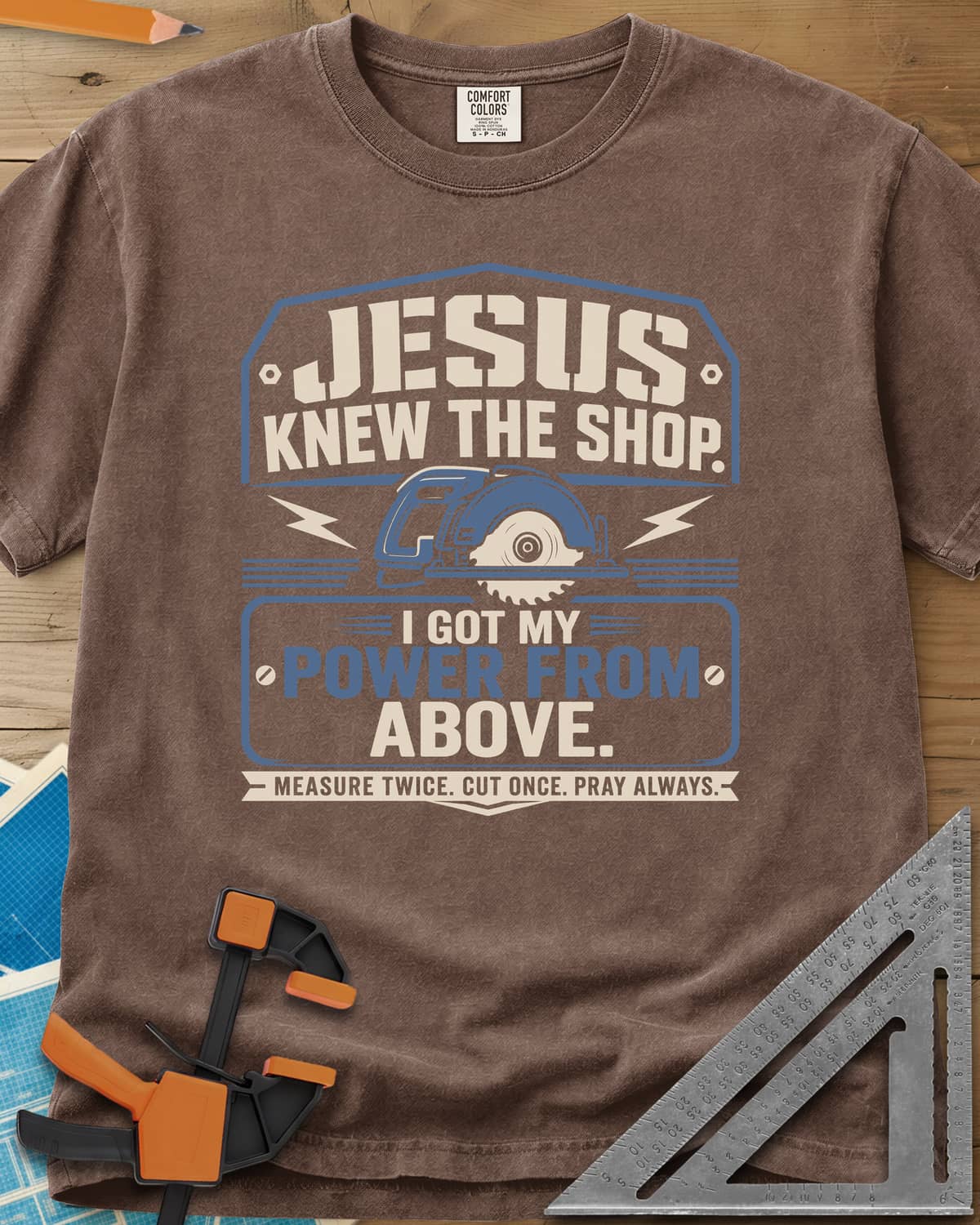 I Got My Power From Above heavyweight tee in Espresso, a blue circular saw with lightning bolts in a badge
