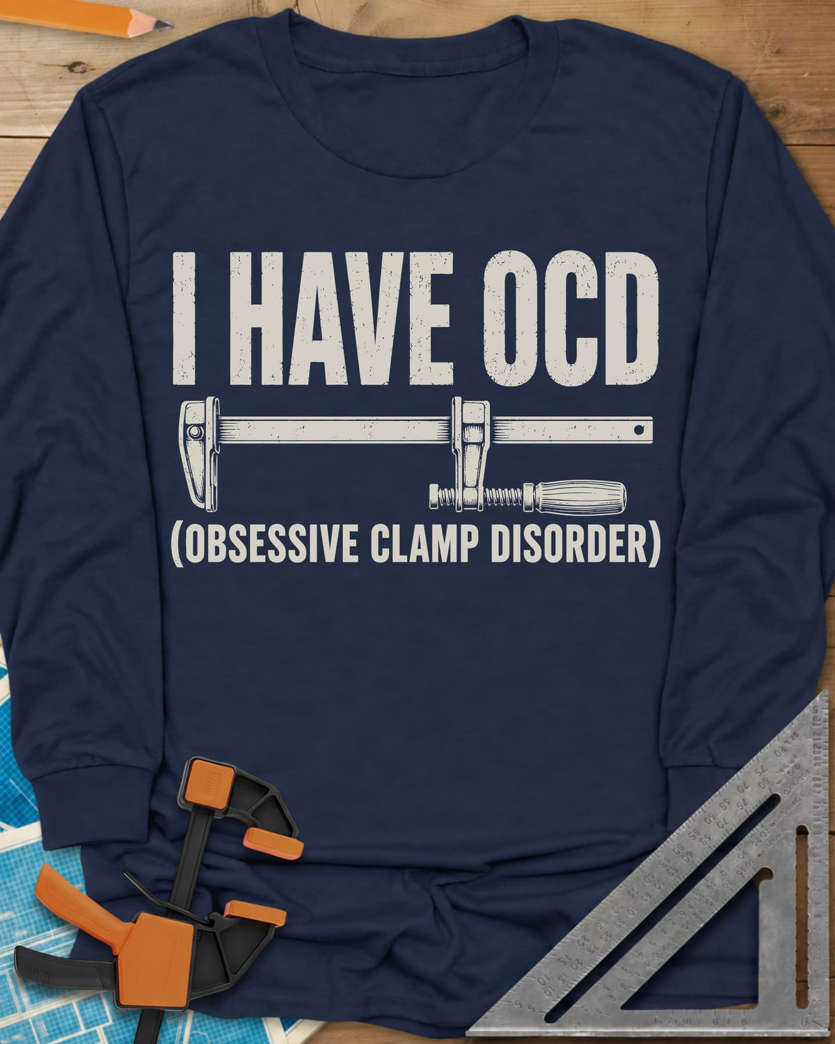 I Have OCD long sleeve shirt in Navy, long bar clamp drawn between the headline and its explanation