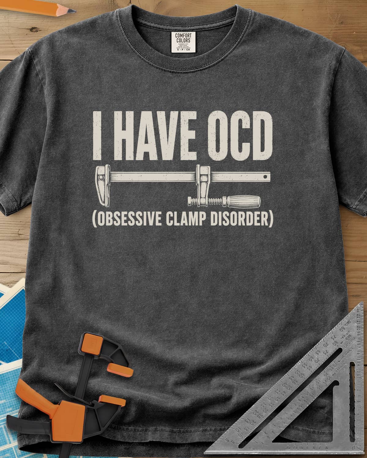 I Have OCD heavyweight tee in Pepper, long bar clamp drawn between the headline and its explanation