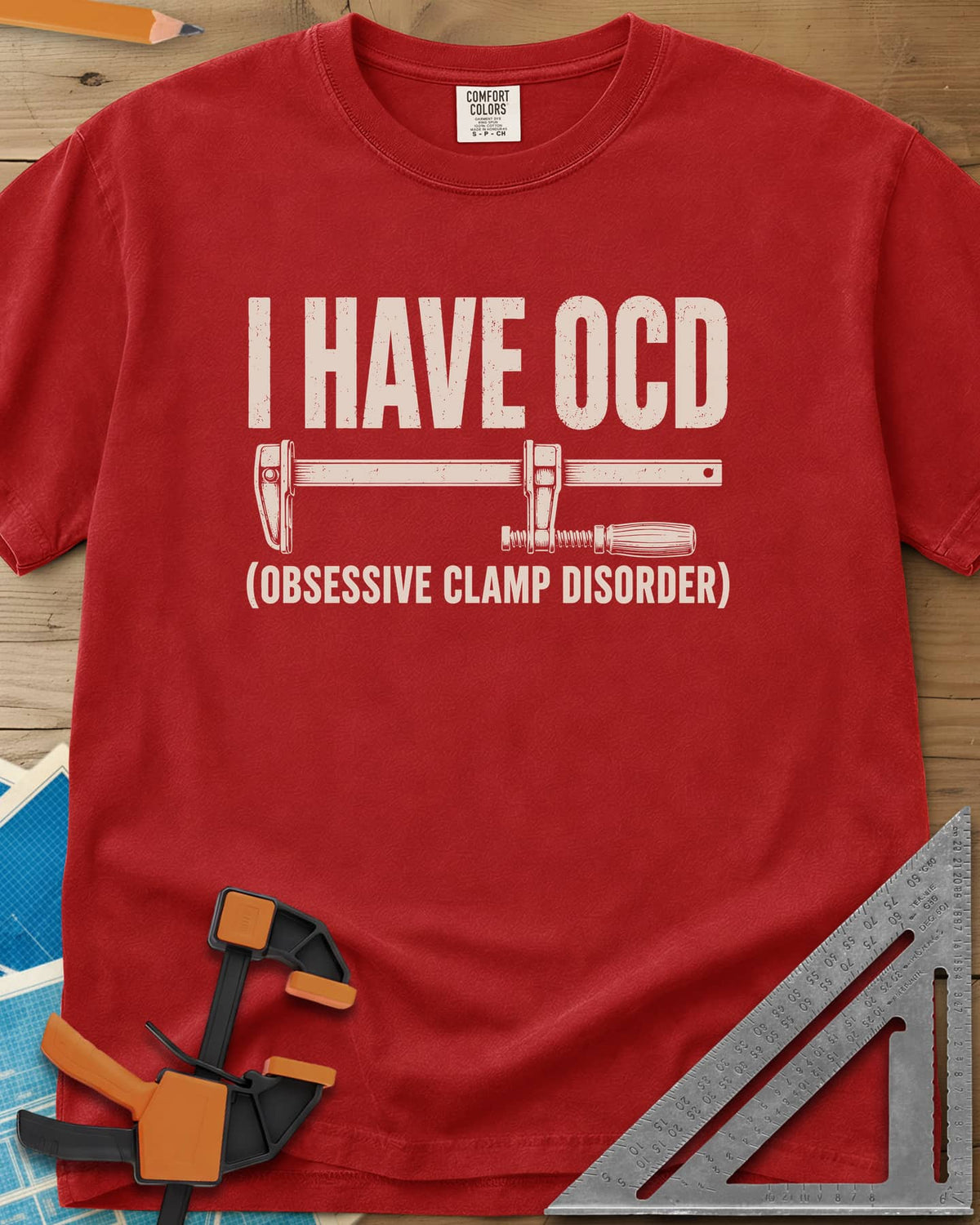I Have OCD heavyweight tee in Red, long bar clamp drawn between the headline and its explanation