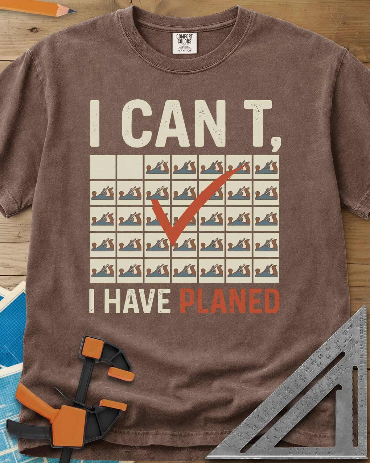 I Have Planed heavyweight tee in Espresso, a calendar grid of hand planes with one red check mark
