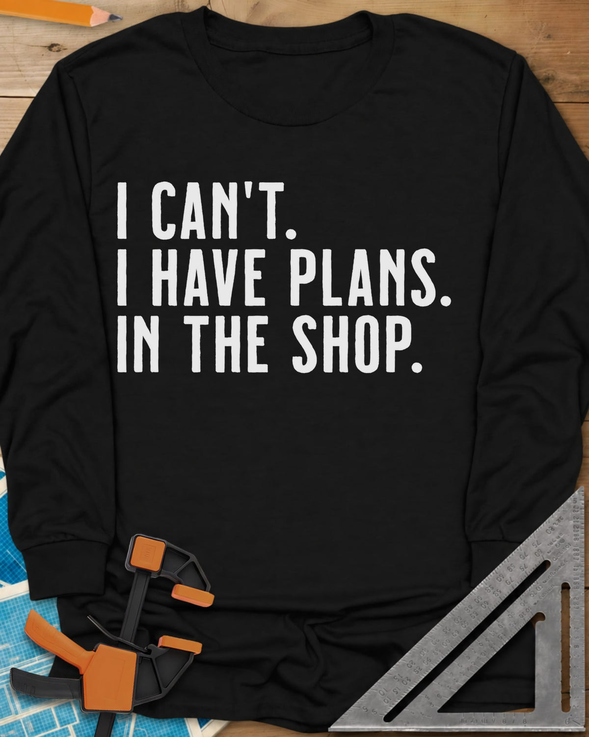 I Have Plans In The Shop long sleeve shirt in Black, three lines of plain condensed capitals, no graphic