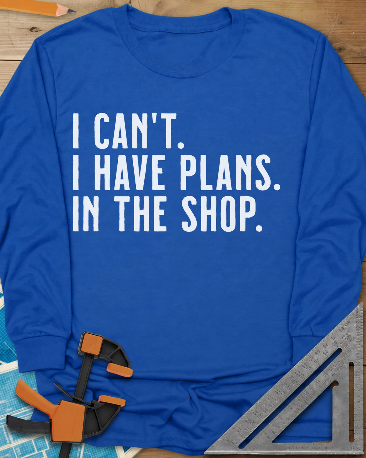 I Have Plans In The Shop long sleeve shirt in Royal, three lines of plain condensed capitals, no graphic