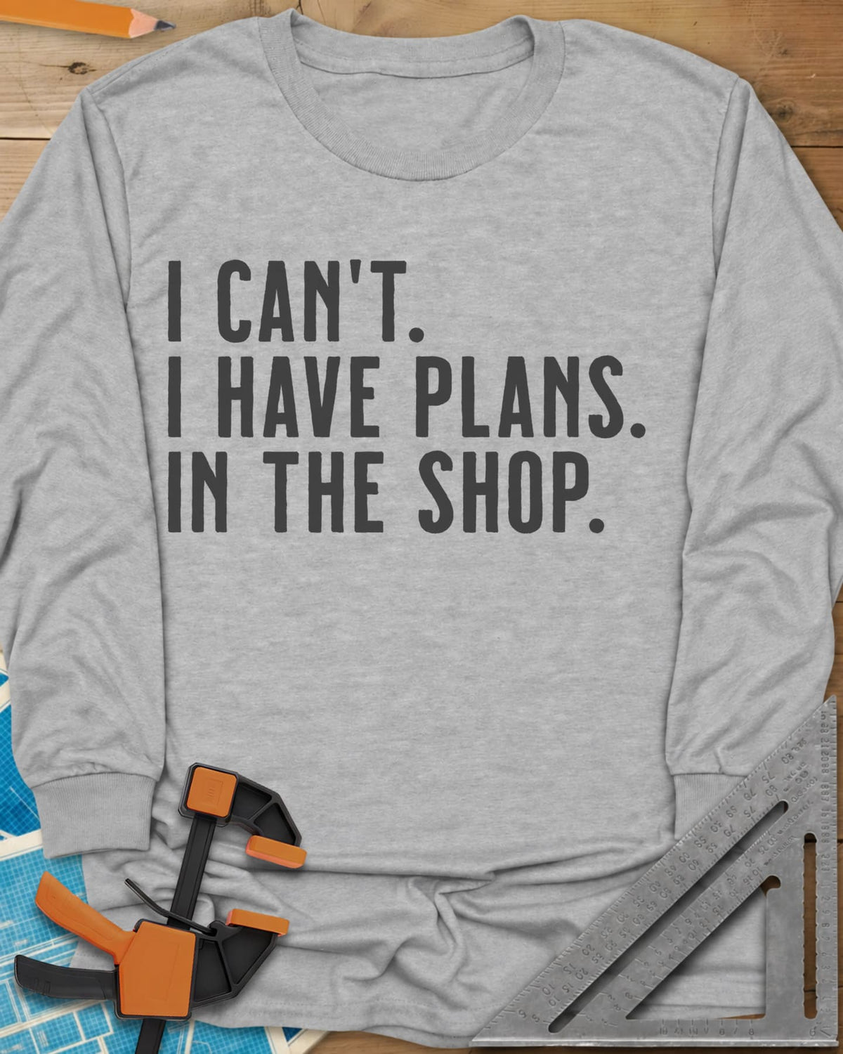 I Have Plans In The Shop long sleeve shirt in Sport Grey, three lines of plain condensed capitals, no graphic