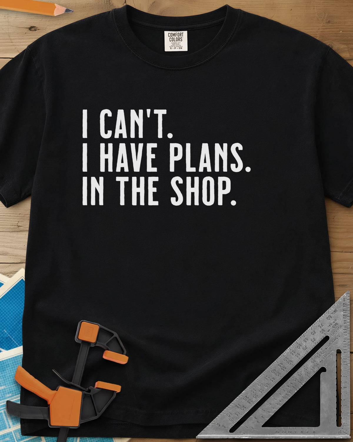 I Have Plans In The Shop heavyweight tee in Black, three lines of plain condensed capitals, no graphic