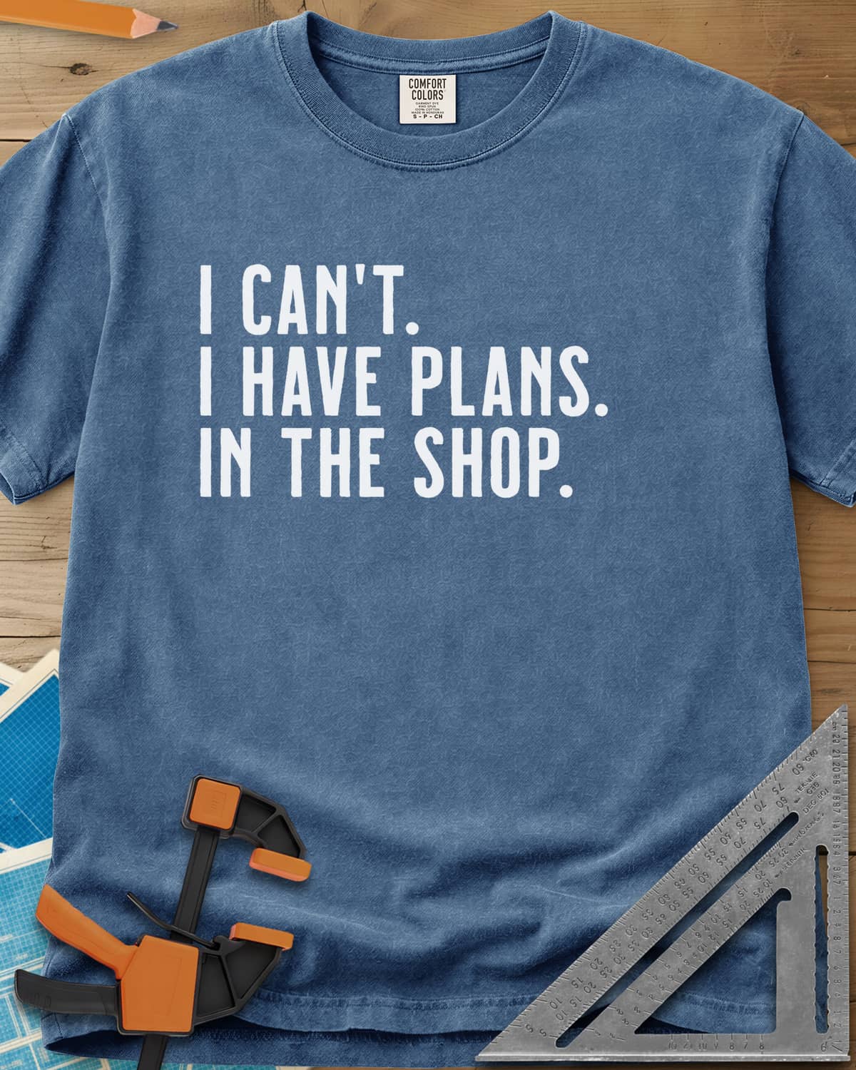 I Have Plans In The Shop heavyweight tee in Blue Jean, three lines of plain condensed capitals, no graphic