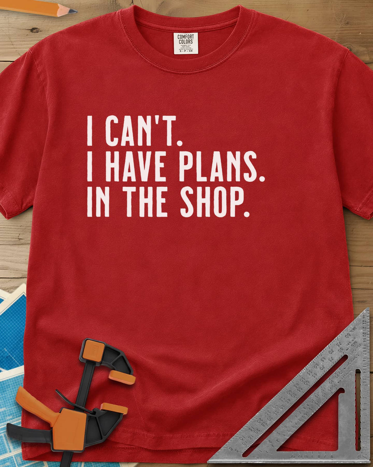 I Have Plans In The Shop heavyweight tee in Red, three lines of plain condensed capitals, no graphic