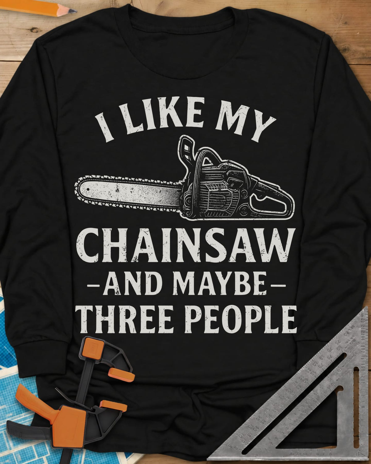 I Like My Chainsaw long sleeve shirt in Black, distressed chainsaw drawing between the first and second lines