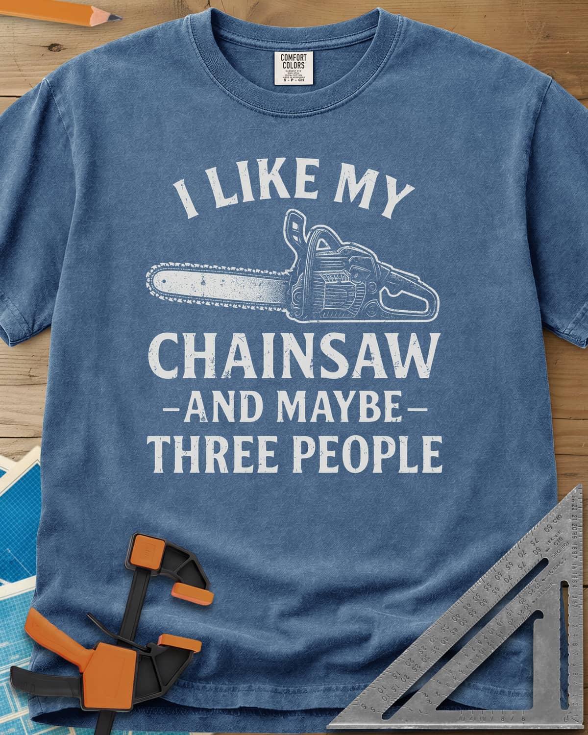 I Like My Chainsaw heavyweight tee in Blue Jean, distressed chainsaw drawing between the first and second lines