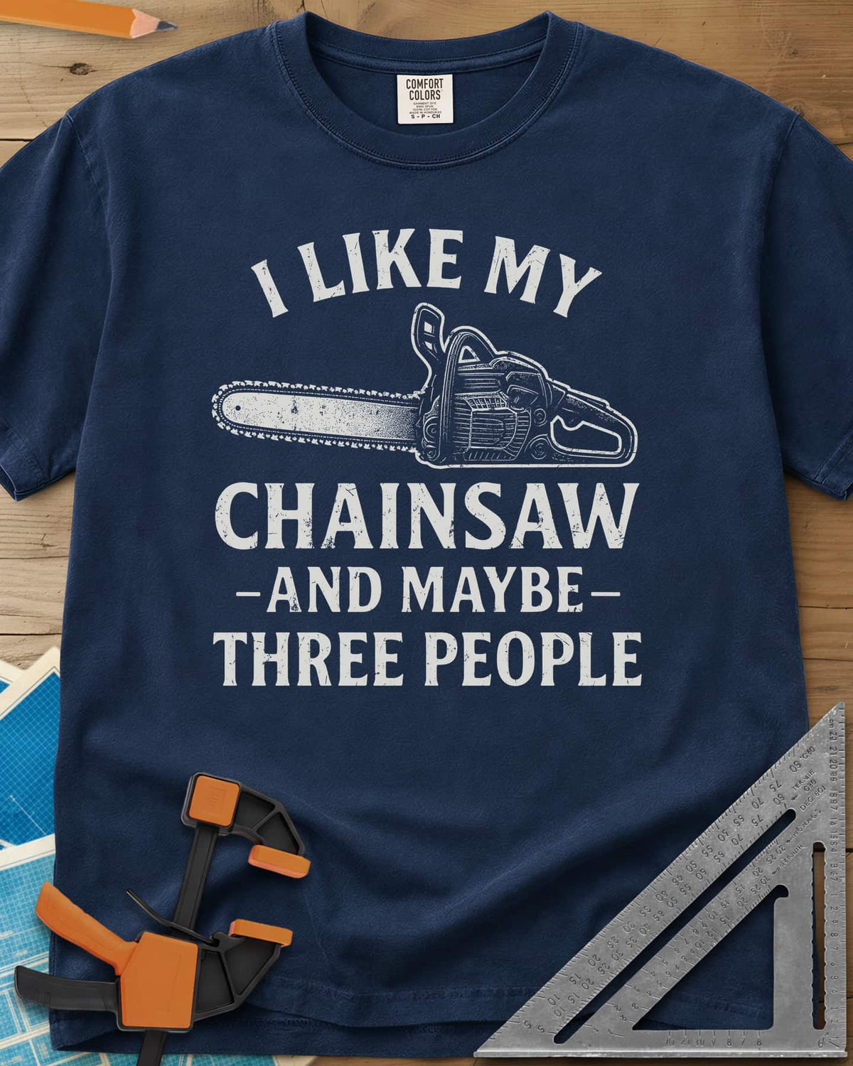 I Like My Chainsaw heavyweight tee in Navy, distressed chainsaw drawing between the first and second lines