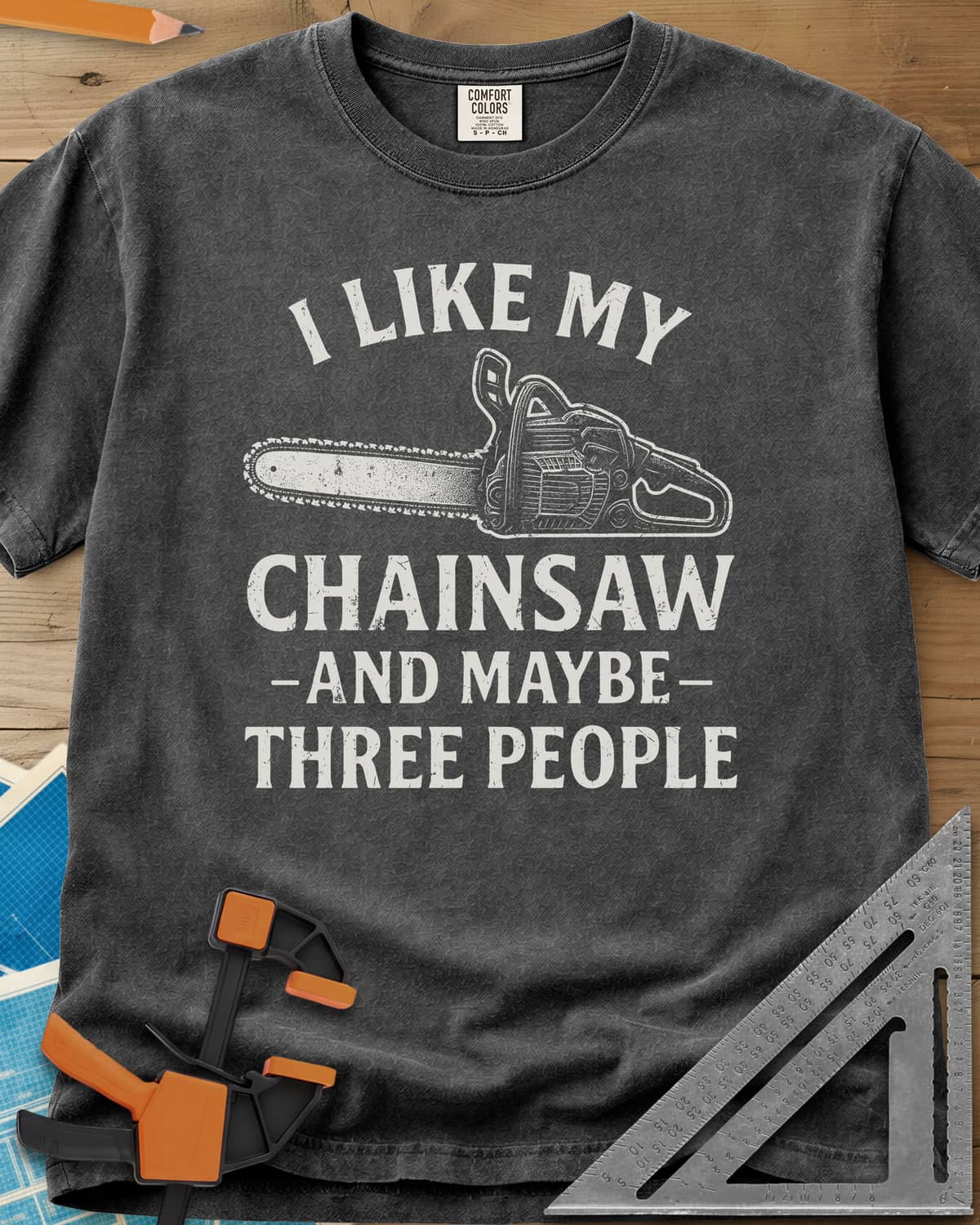 I Like My Chainsaw heavyweight tee in Pepper, distressed chainsaw drawing between the first and second lines