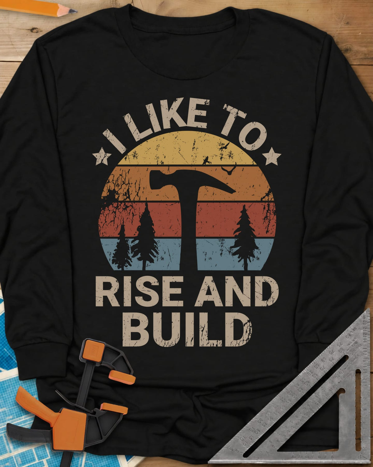 I Like To Rise And Build long sleeve shirt in Black, a retro striped sunset with a hammer silhouette and pine trees