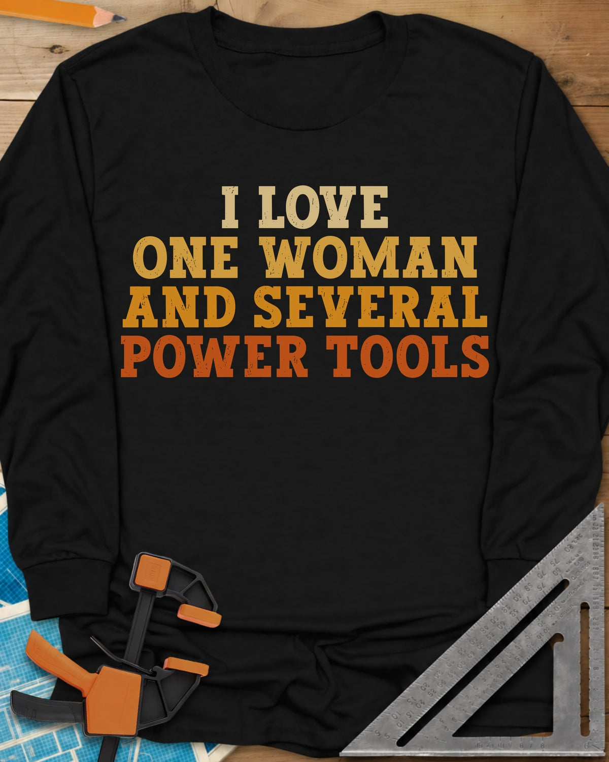 I Love One Woman And Several Power Tools long sleeve shirt in Black, four stacked lines of slab-serif type fading from cream