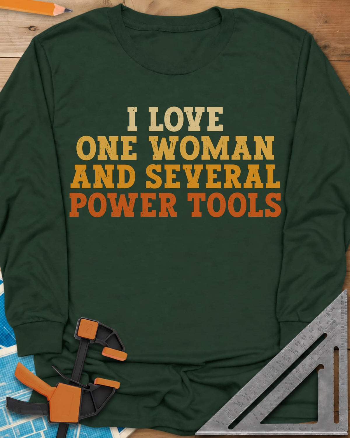 I Love One Woman And Several Power Tools long sleeve shirt in Forest Green, four stacked lines of slab-serif type fading