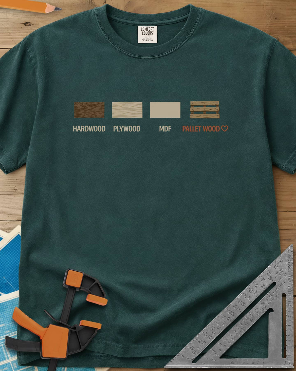 I Love Pallet Wood heavyweight tee in Blue Spruce, four wood swatches labeled hardwood, plywood, MDF and pallet wood