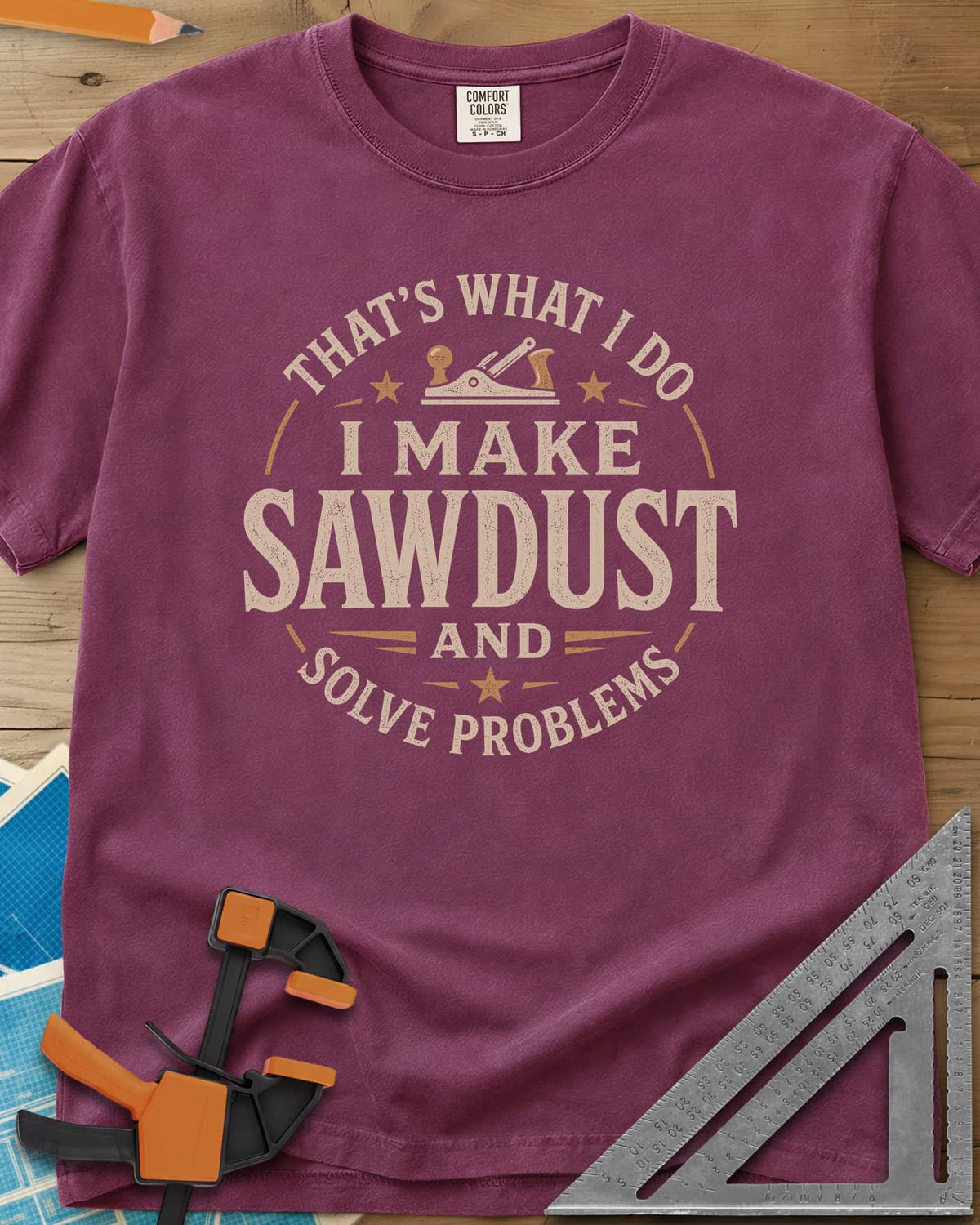 I Make Sawdust heavyweight tee in Berry, a round badge with a hand plane and stars around the words