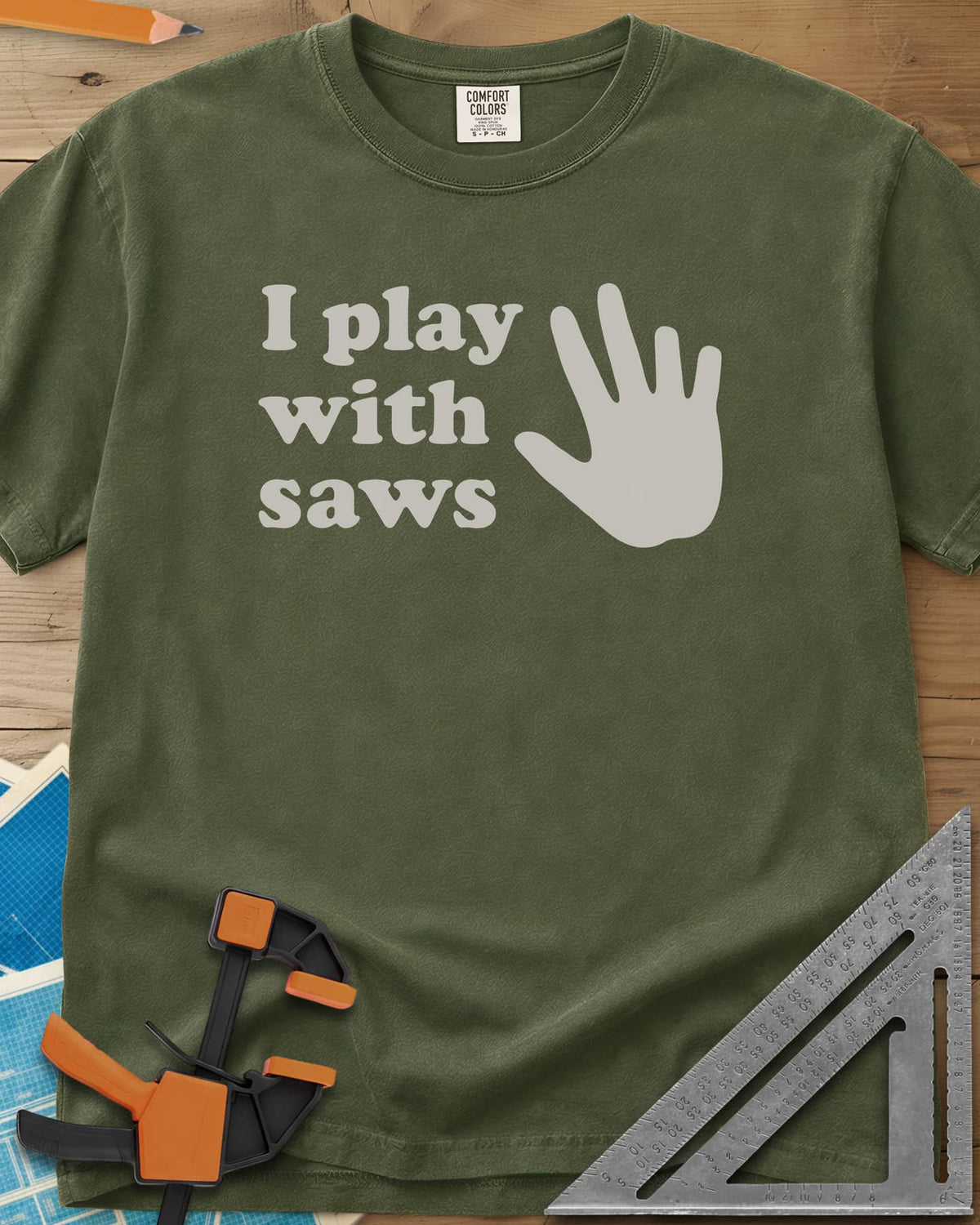 I Play With Saws heavyweight tee in Hemp, rounded lowercase lettering beside a big open hand, five fingers