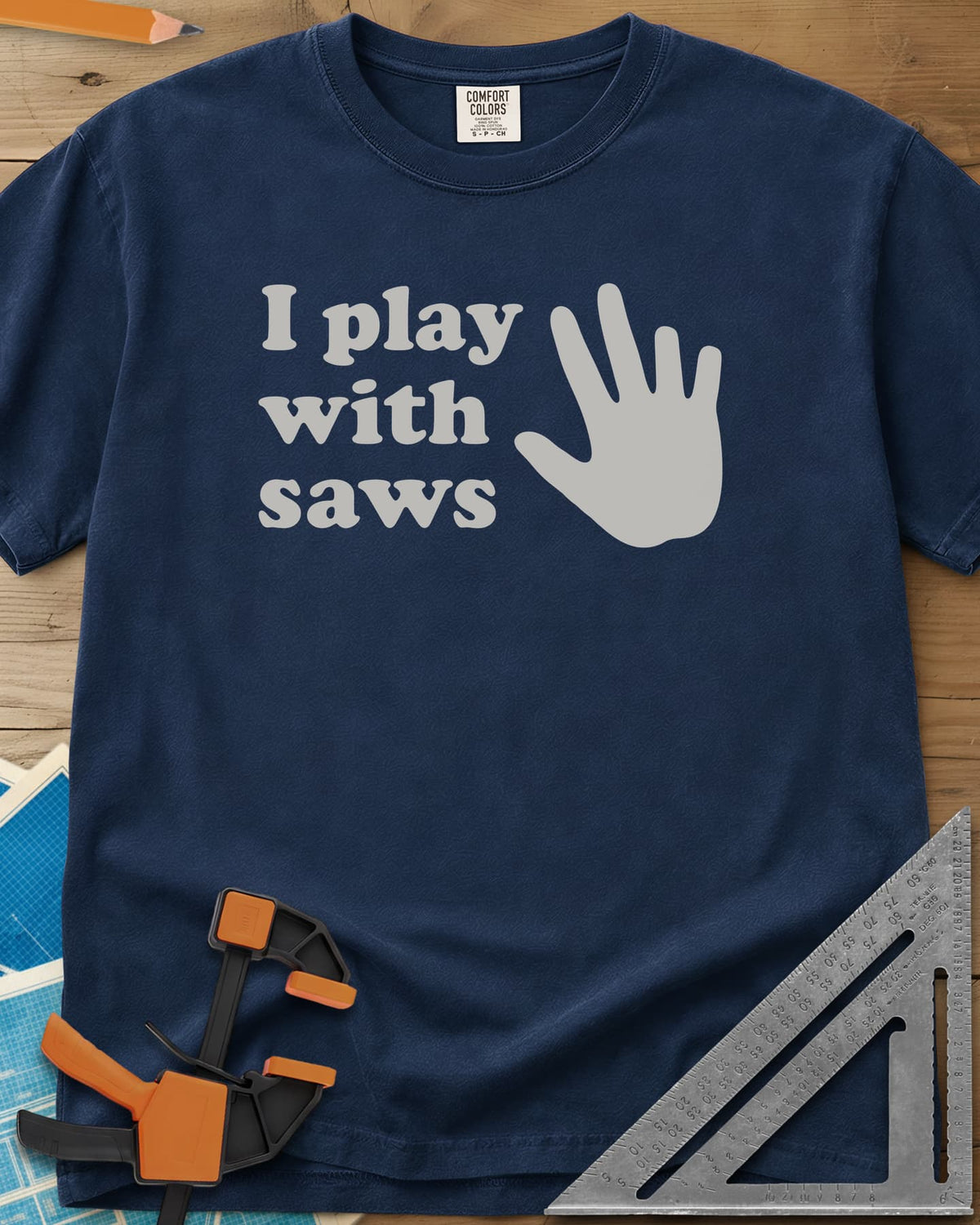 I Play With Saws heavyweight tee in Navy, rounded lowercase lettering beside a big open hand, five fingers