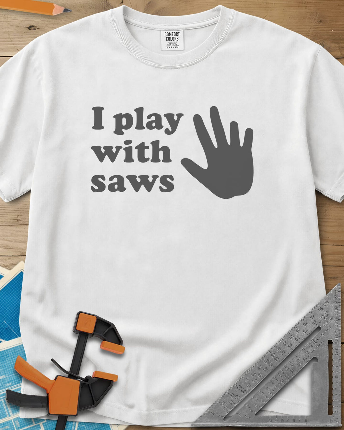 I Play With Saws heavyweight tee in White, rounded lowercase lettering beside a big open hand, five fingers