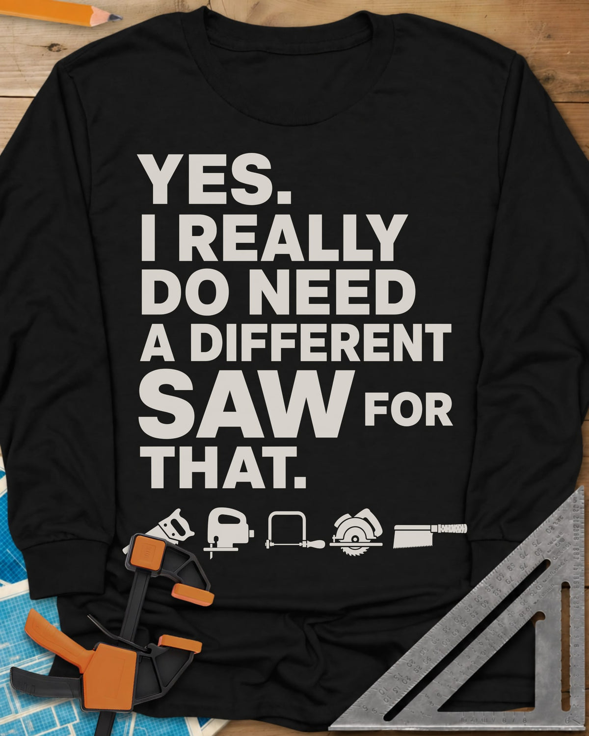 I Really Do Need A Different Saw long sleeve shirt in Black, bold stacked lettering above a row of five small saw icons