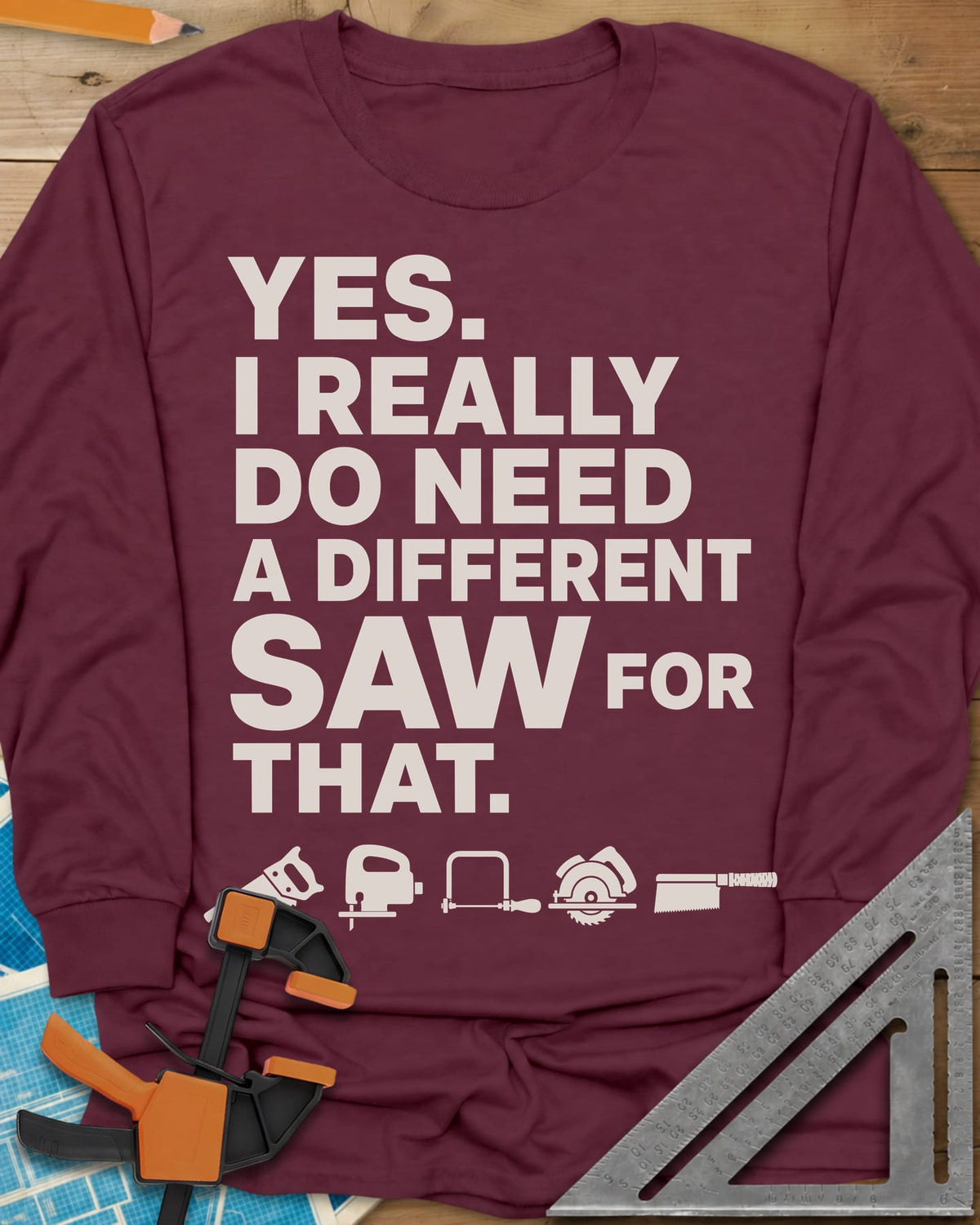 I Really Do Need A Different Saw long sleeve shirt in Maroon, bold stacked lettering above a row of five small saw icons