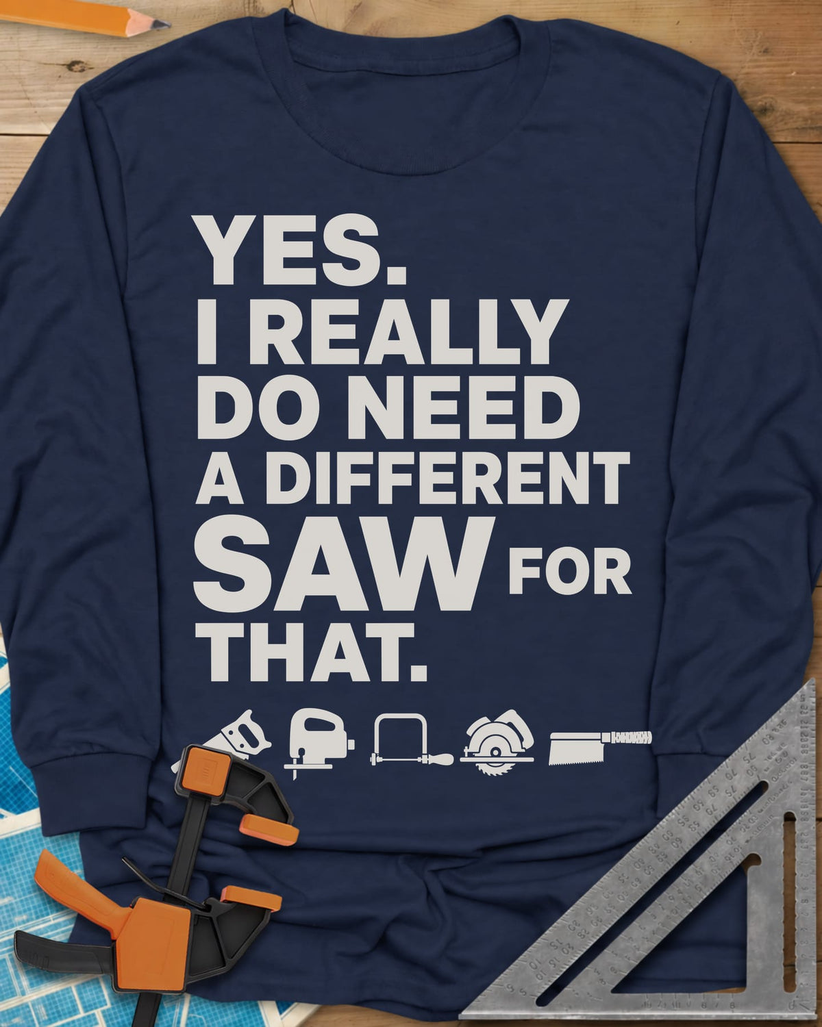 I Really Do Need A Different Saw long sleeve shirt in Navy, bold stacked lettering above a row of five small saw icons