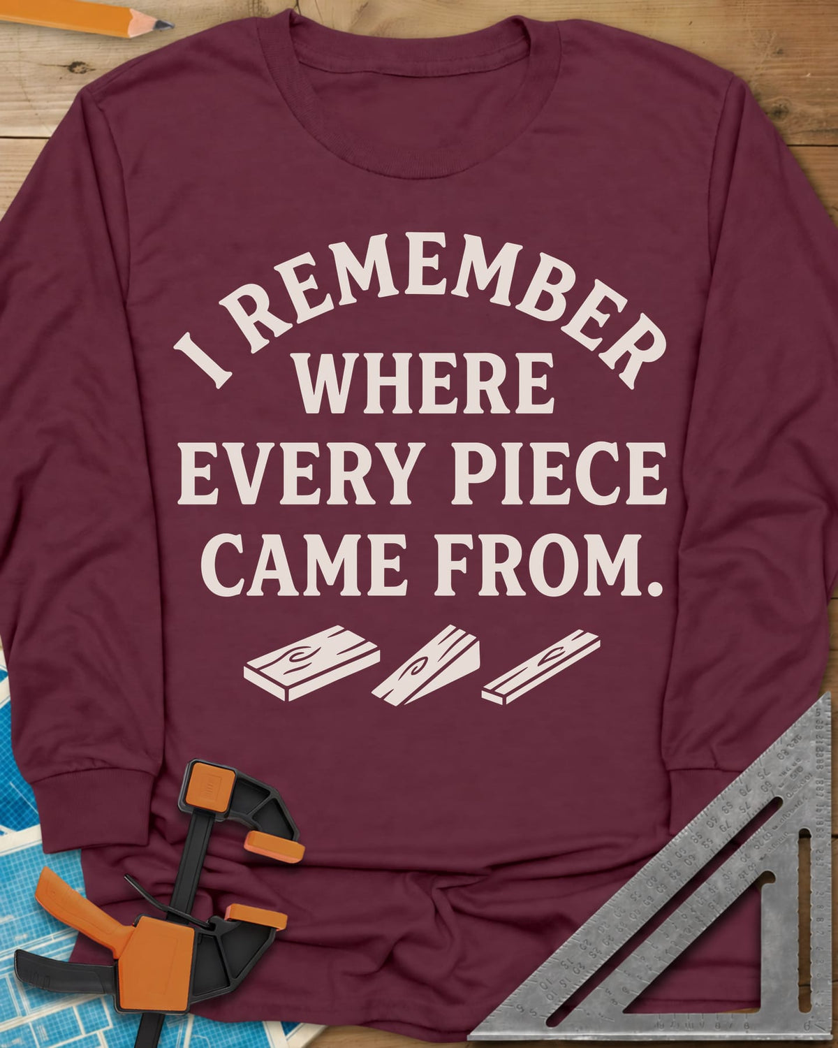 I Remember Where Every Piece Came From long sleeve shirt in Maroon, arched lettering above three small boards with swirled