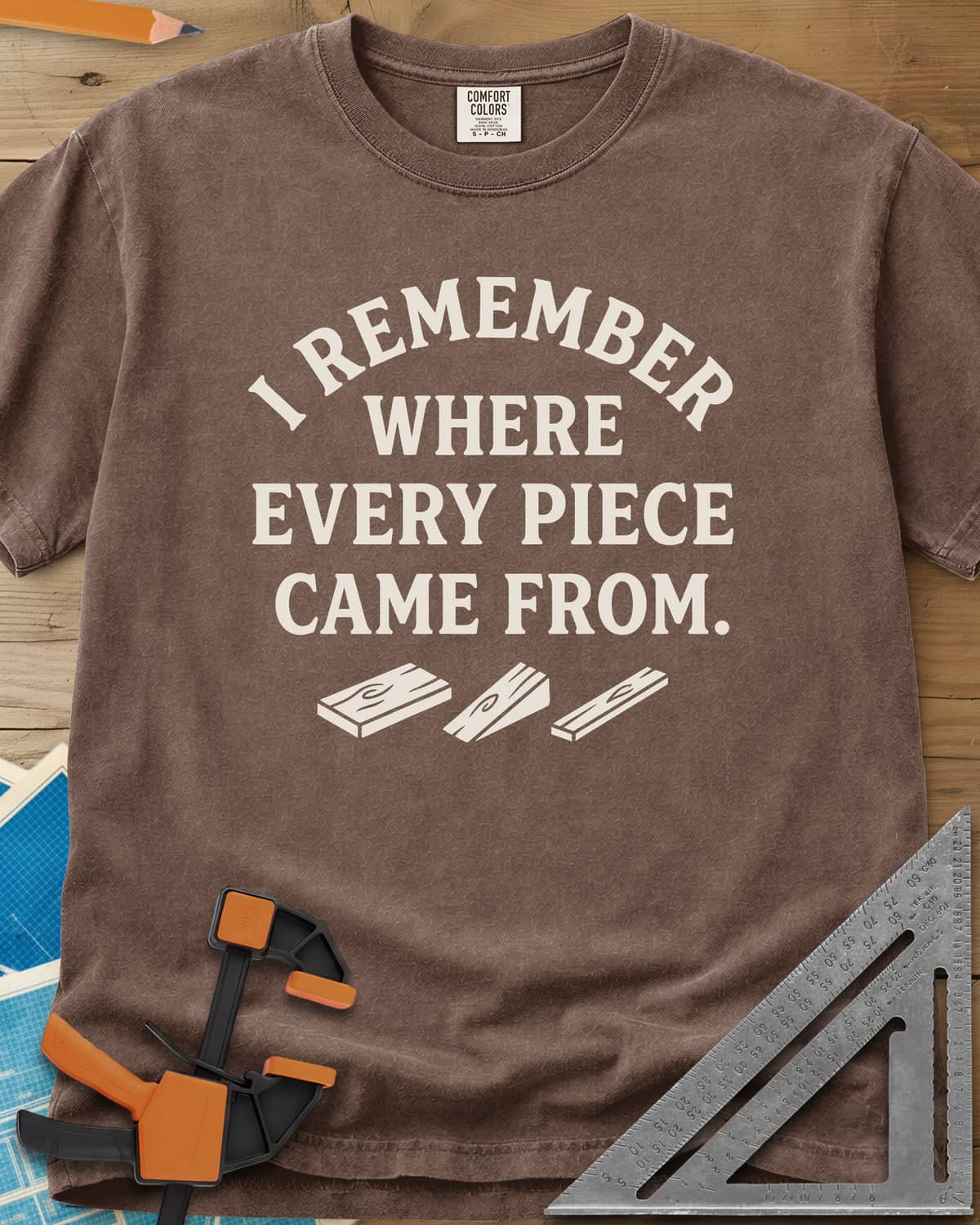 I Remember Where Every Piece Came From heavyweight tee in Espresso, arched lettering above three small boards with swirled