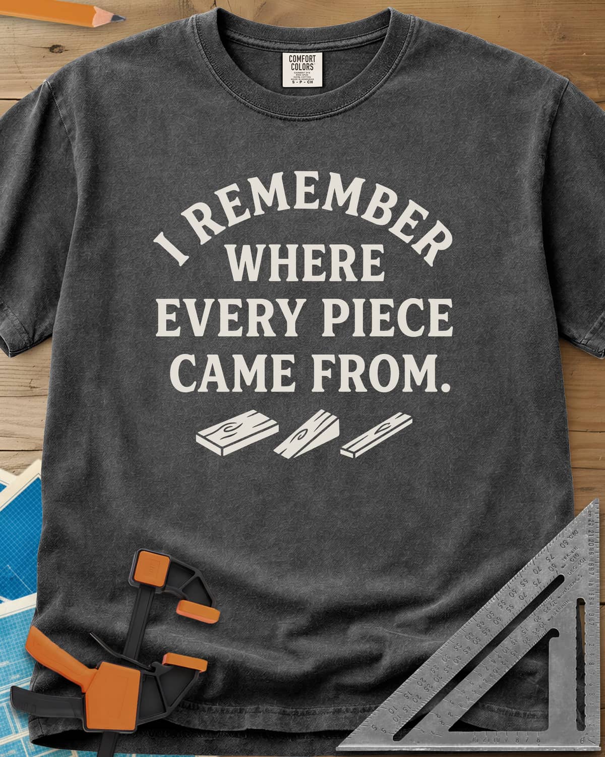 I Remember Where Every Piece Came From heavyweight tee in Pepper, arched lettering above three small boards with swirled