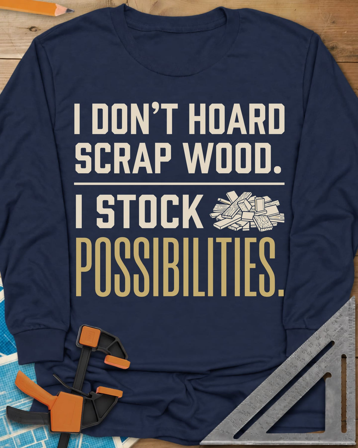 I Stock Possibilities long sleeve shirt in Navy, bold lettering beside a small pile of scrap wood offcuts