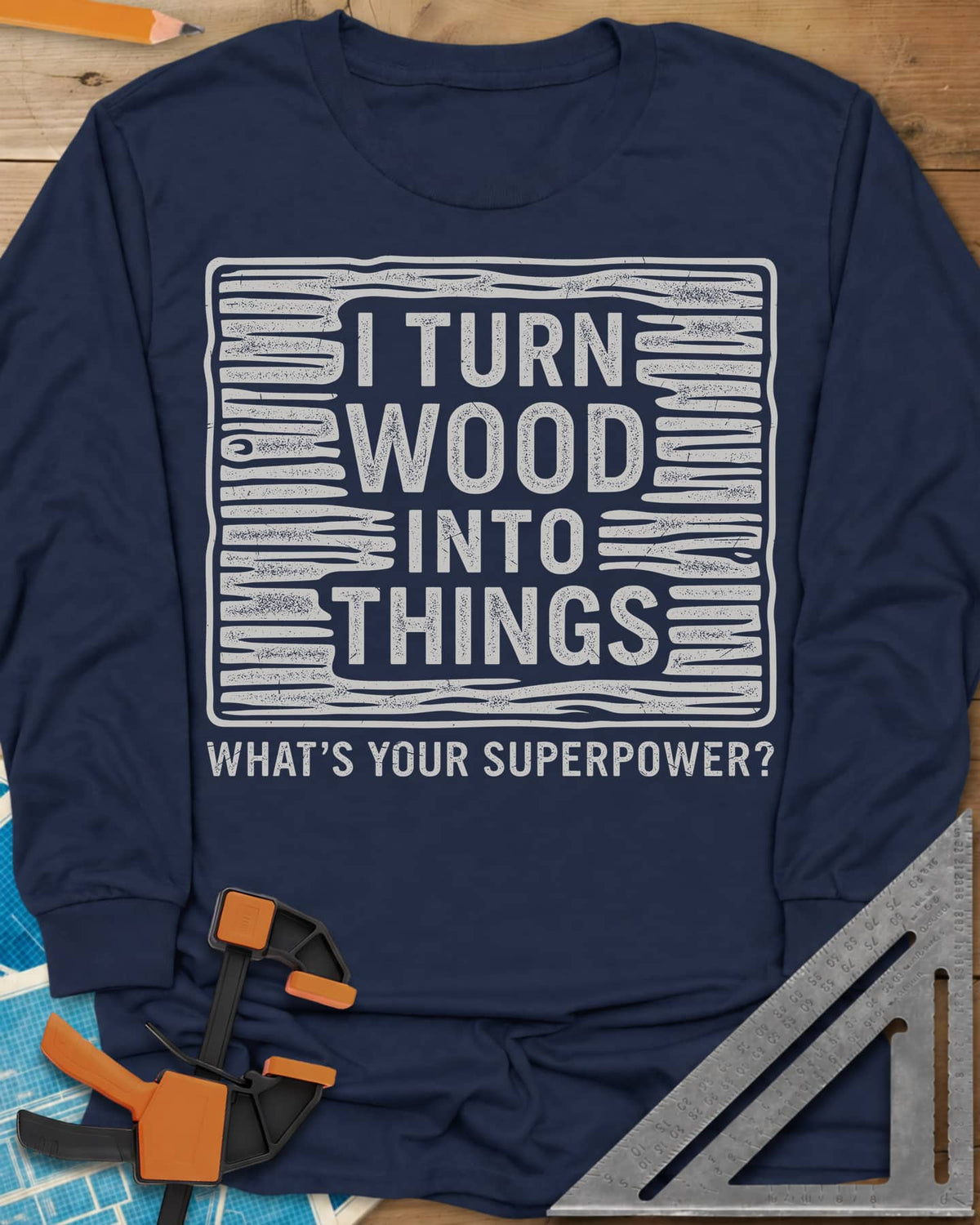 I Turn Wood Into Things long sleeve shirt in Navy, stacked block lettering inside a hand-drawn wood-grain frame