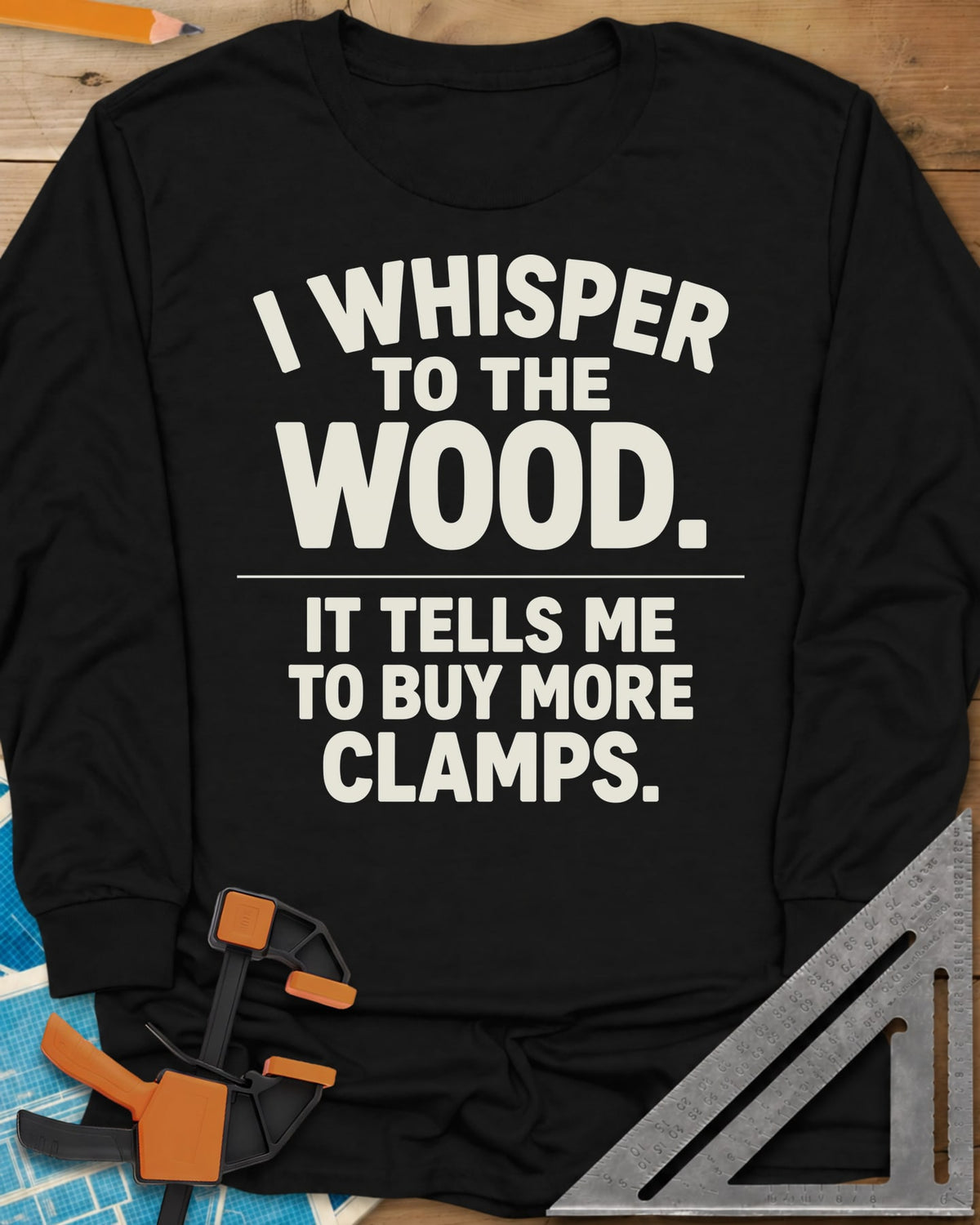 I Whisper To The Wood Clamp Humor long sleeve shirt in Black, bold stacked lettering split by a thin divider line, no graphic