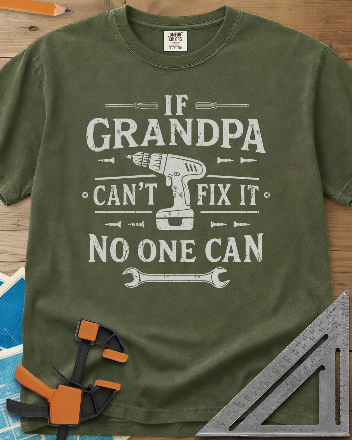 If Grandpa Can't Fix It No One Can heavyweight tee in Hemp, distressed lettering around a cordless drill, screws and a wrench