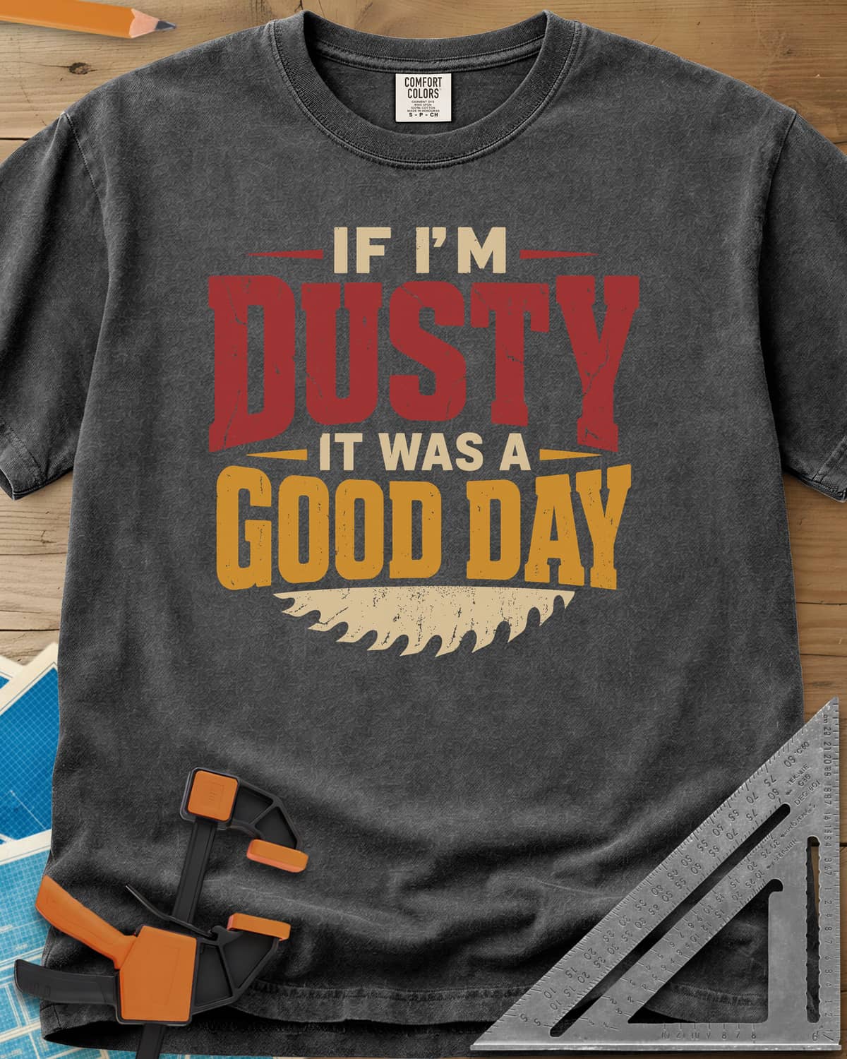 If I'm Dusty It Was A Good Day heavyweight tee in Pepper, big cracked DUSTY and GOOD DAY lettering over a saw blade edge