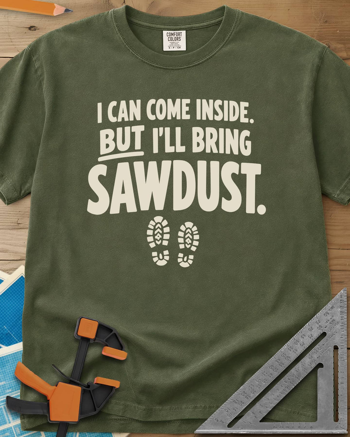 I'll Bring Sawdust heavyweight tee in Hemp, bold lettering above a pair of boot prints