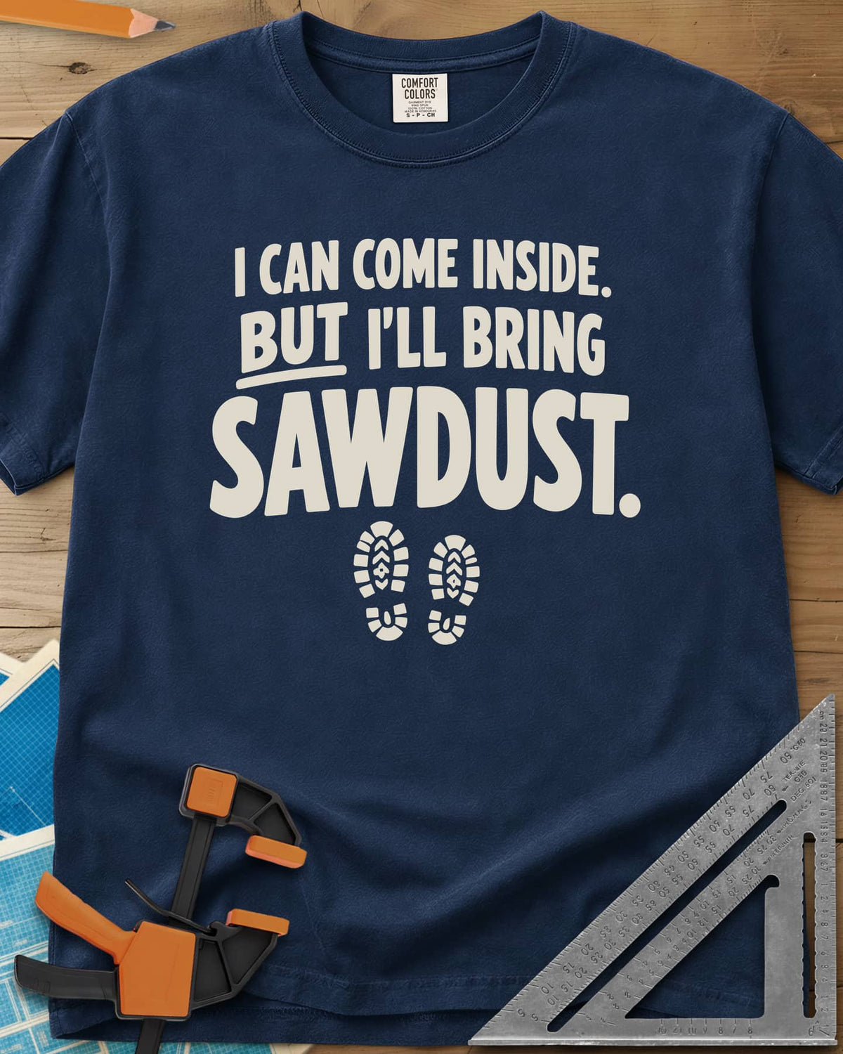 I'll Bring Sawdust heavyweight tee in Navy, bold lettering above a pair of boot prints