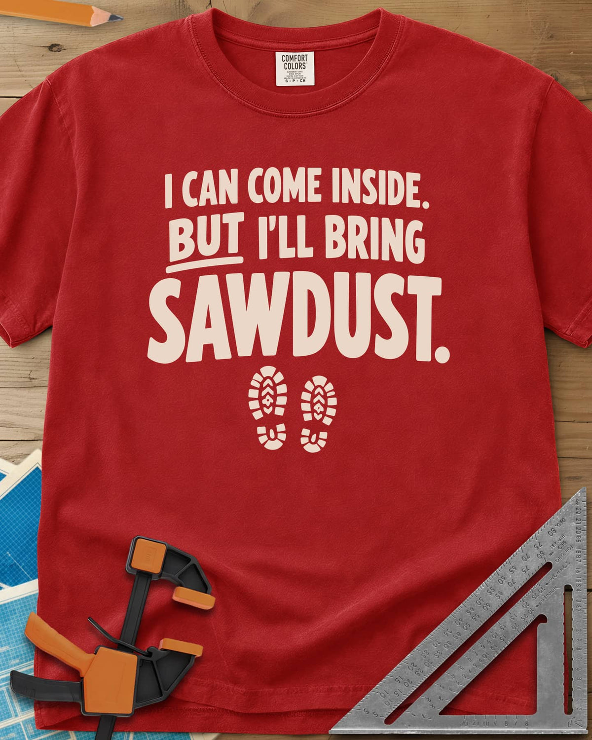 I'll Bring Sawdust heavyweight tee in Red, bold lettering above a pair of boot prints